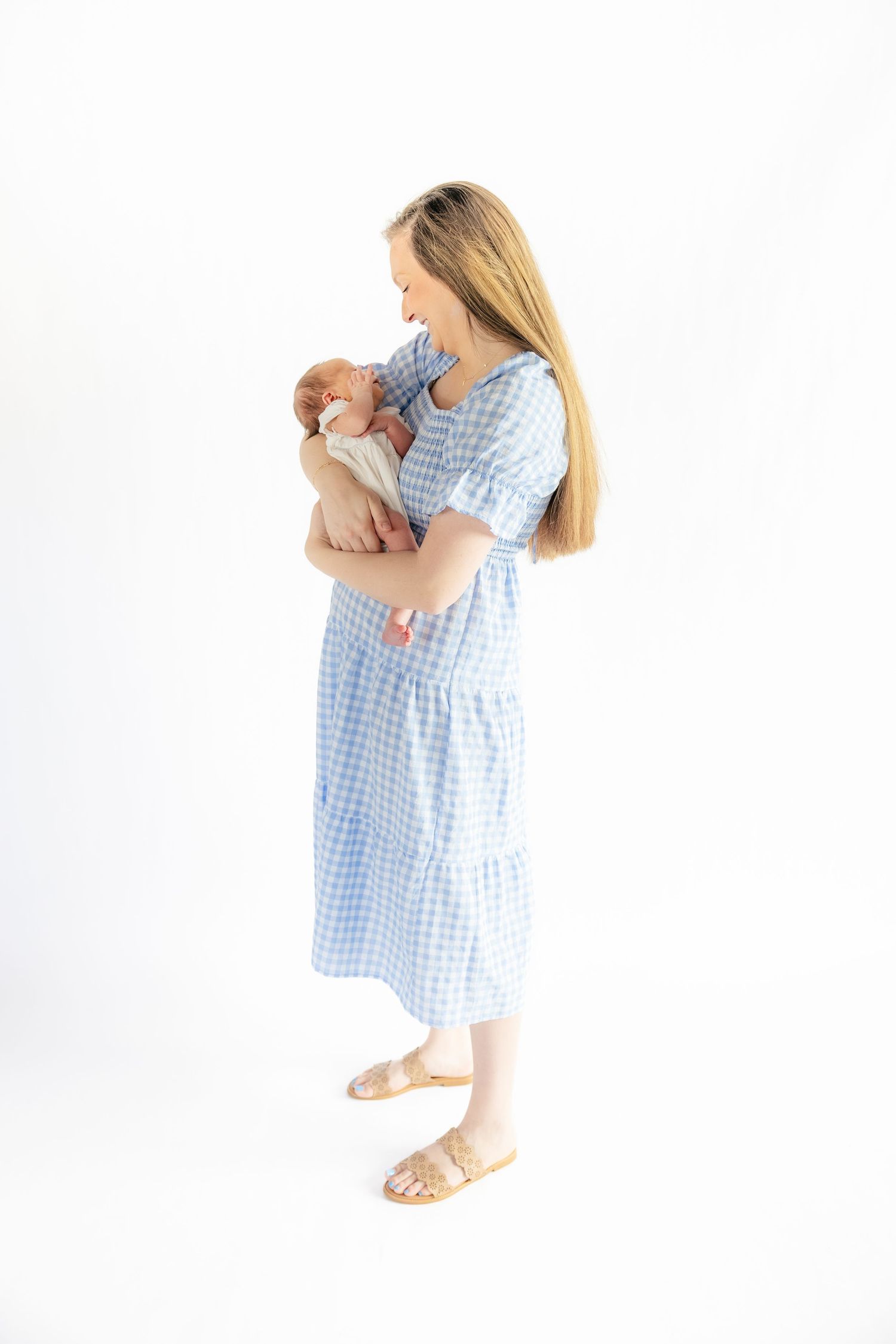Mother holding her baby in a studio in Dothan, Alabama