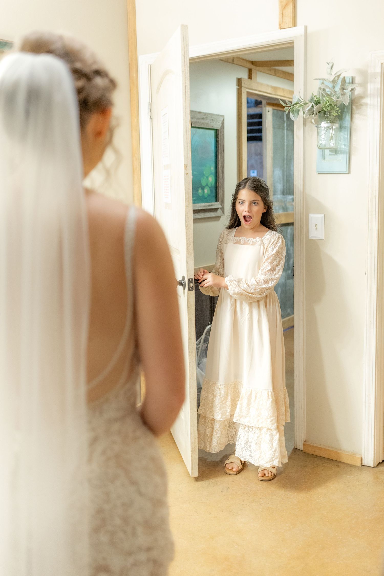 Daughter emotional first look with bride on her wedding day at Hilltop Acres Wicksburg, Alabama