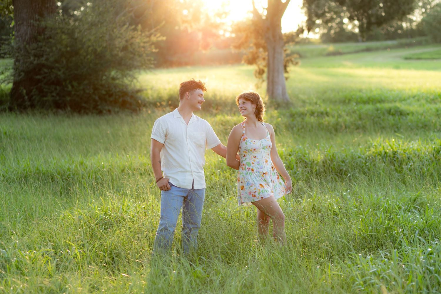 Romantic Couples photos in a tall grass field at sunset near Dothan, Alabama