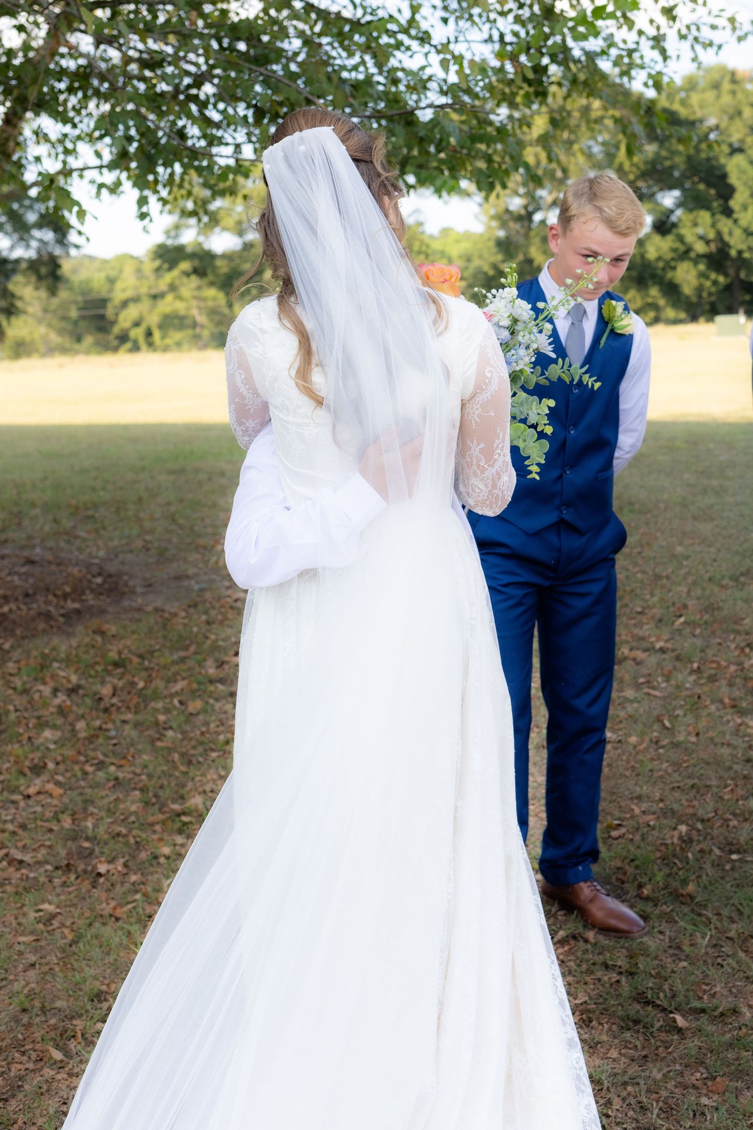 Bride and brothers first look at wedding venue Dalrymple Farms Enterprise, Alabama