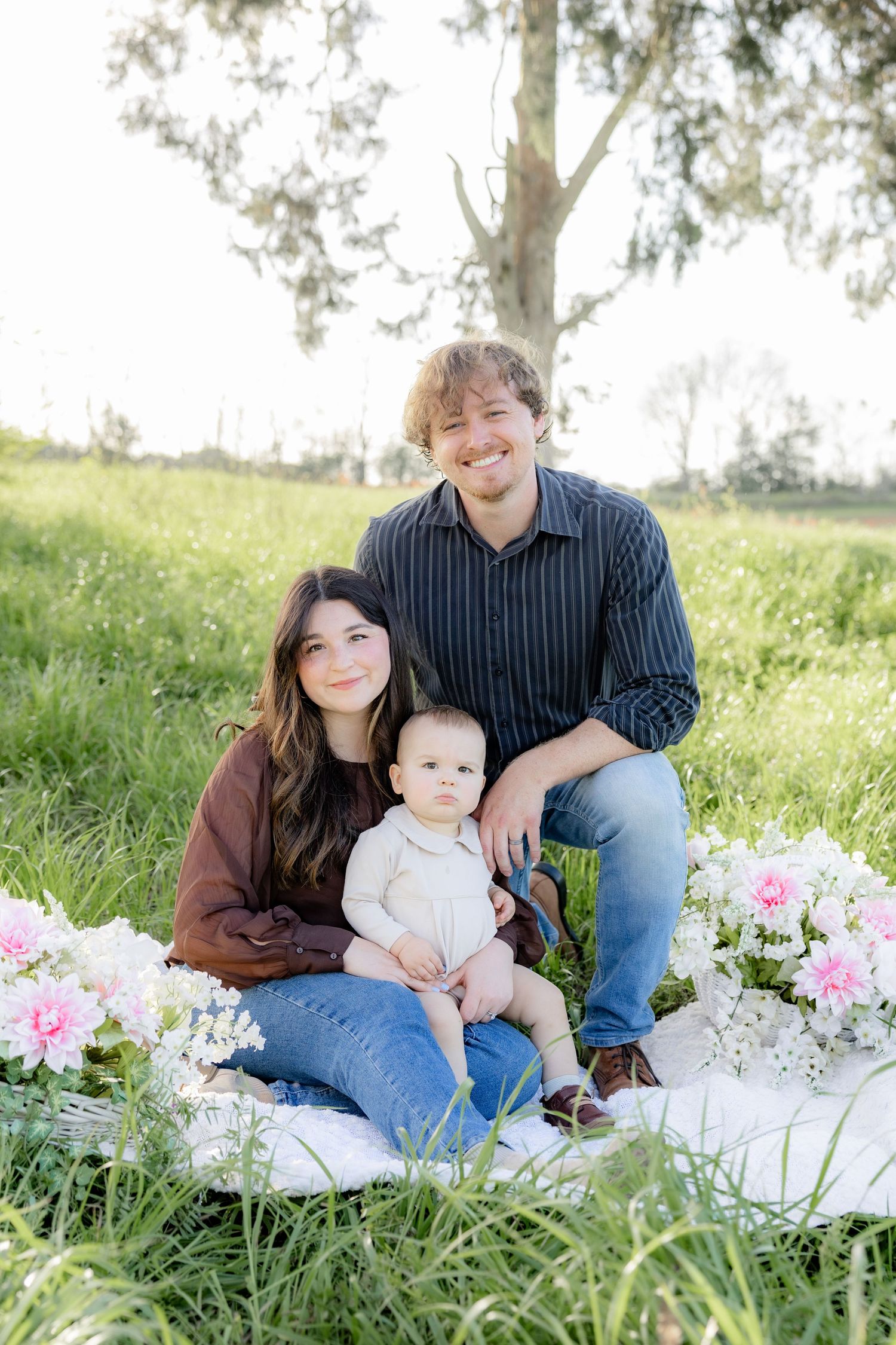 Spring Mini Session with baby chicks in a grass field at sunset near Dothan, Alabama