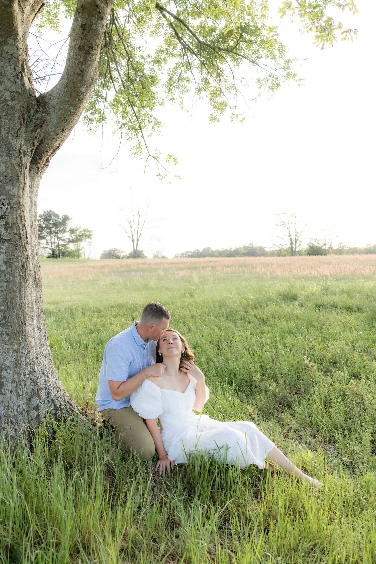 Storytelling couple photos in a tall grass field at sunset in Dothan, Alabama