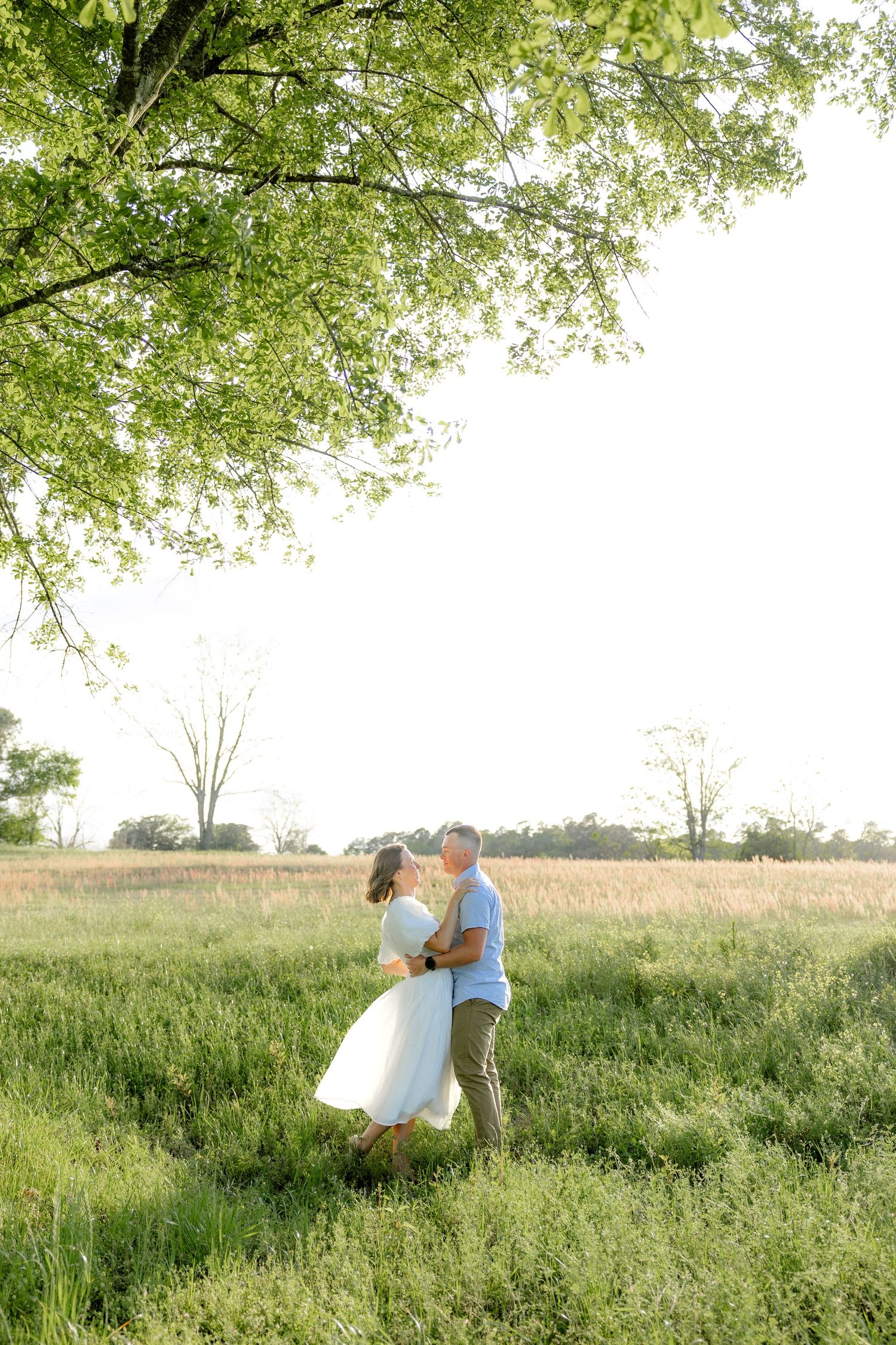 Storytelling couple photos in a tall grass field at sunset in Dothan, Alabama