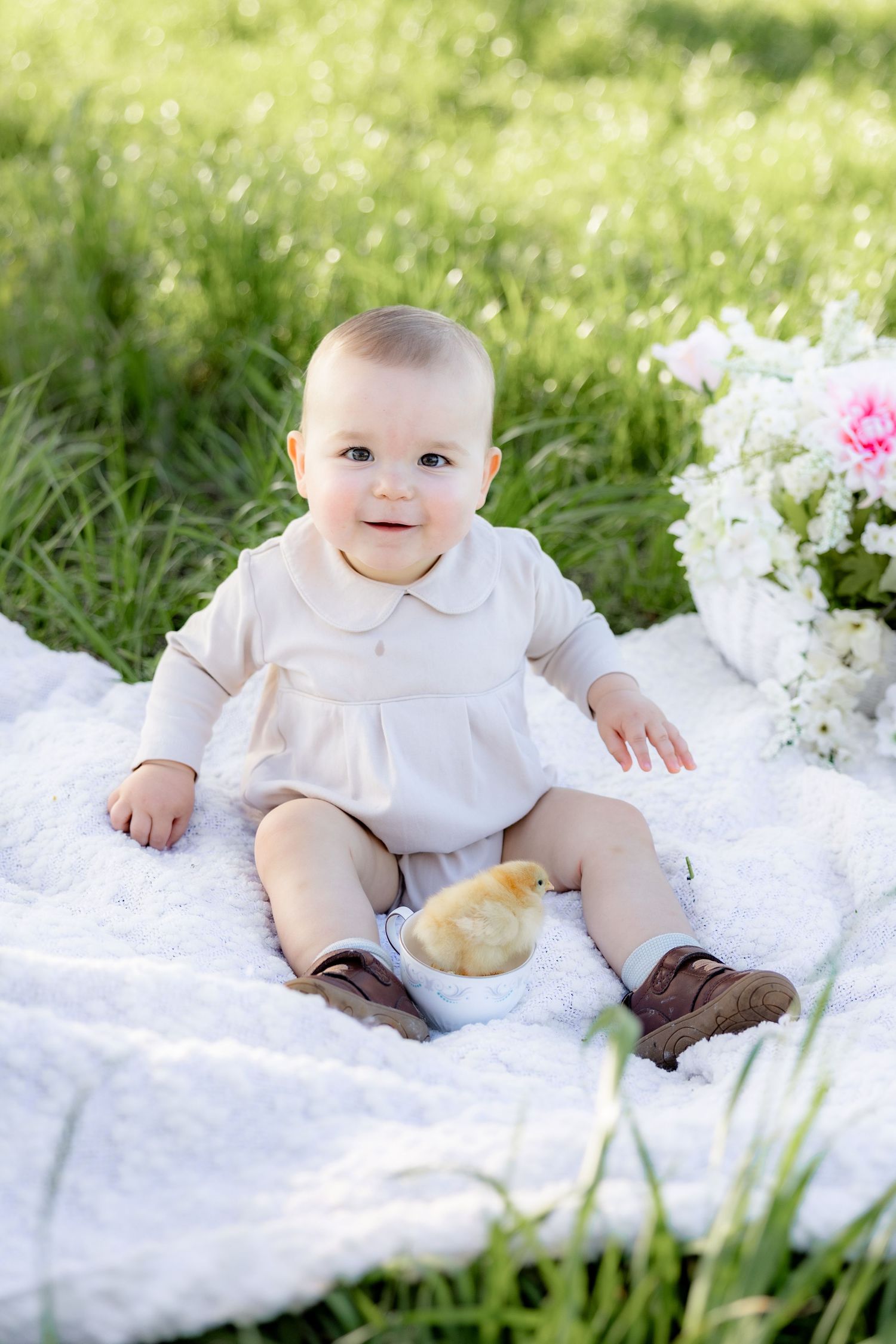 Spring Mini Session with baby chicks in a grass field at sunset near Dothan, Alabama