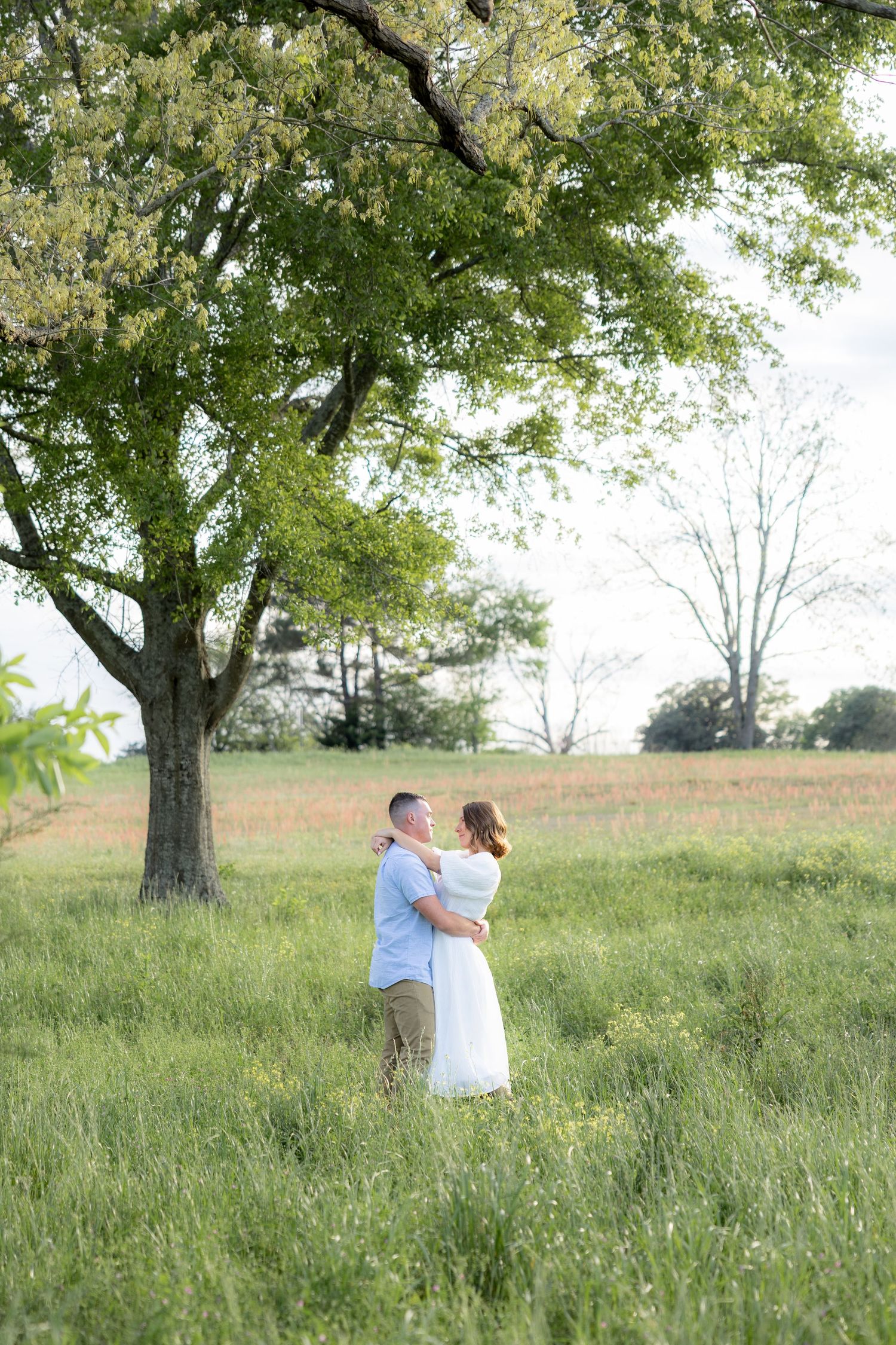 Storytelling romantic couple photos in a tall grass field at sunset in Dothan, Alabama