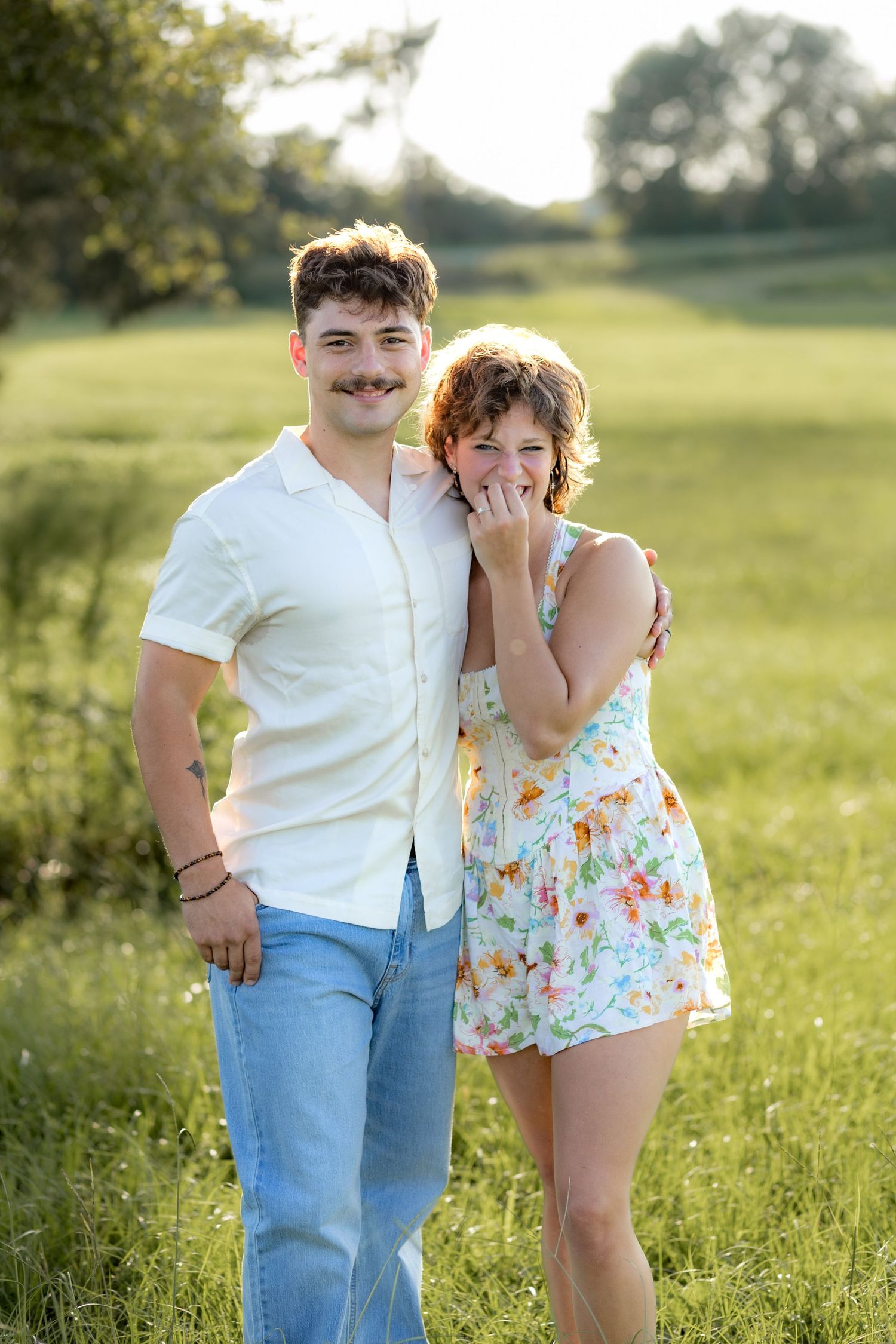 Romantic Couples photos in a tall grass field at sunset near Dothan, Alabama