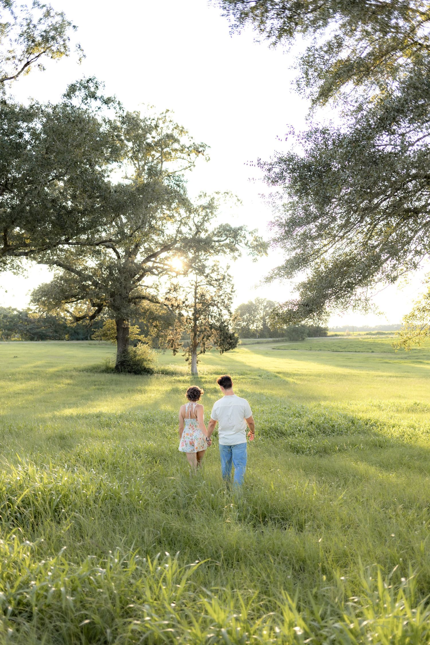Romantic Couples photos in a tall grass field at sunset near Dothan, Alabama