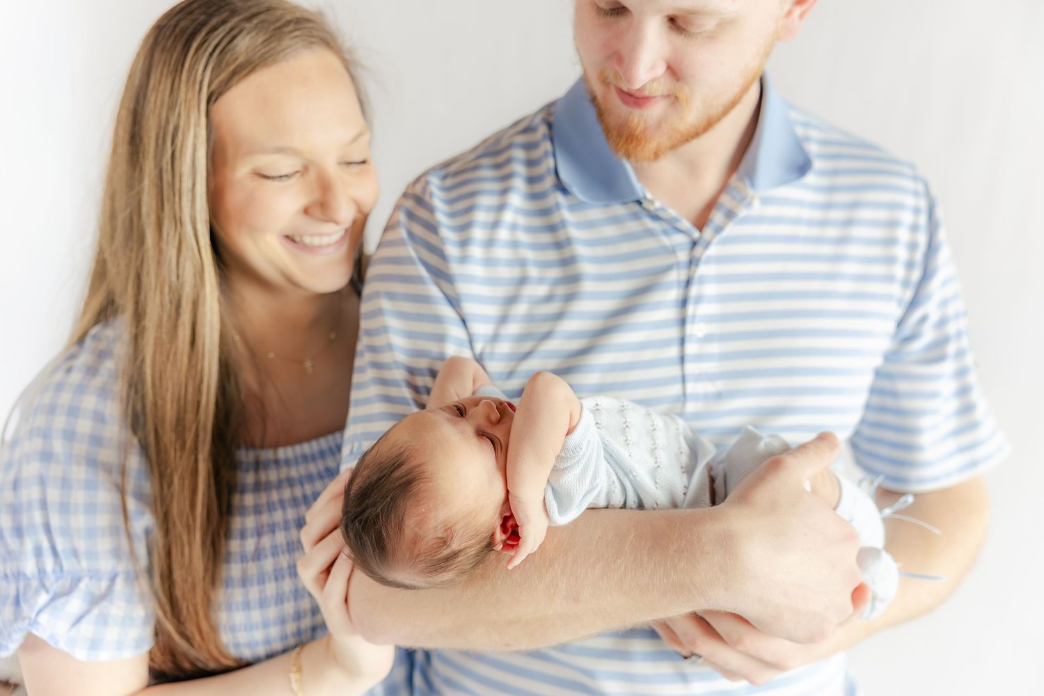Family holding their baby in a studio in Dothan, Alabama