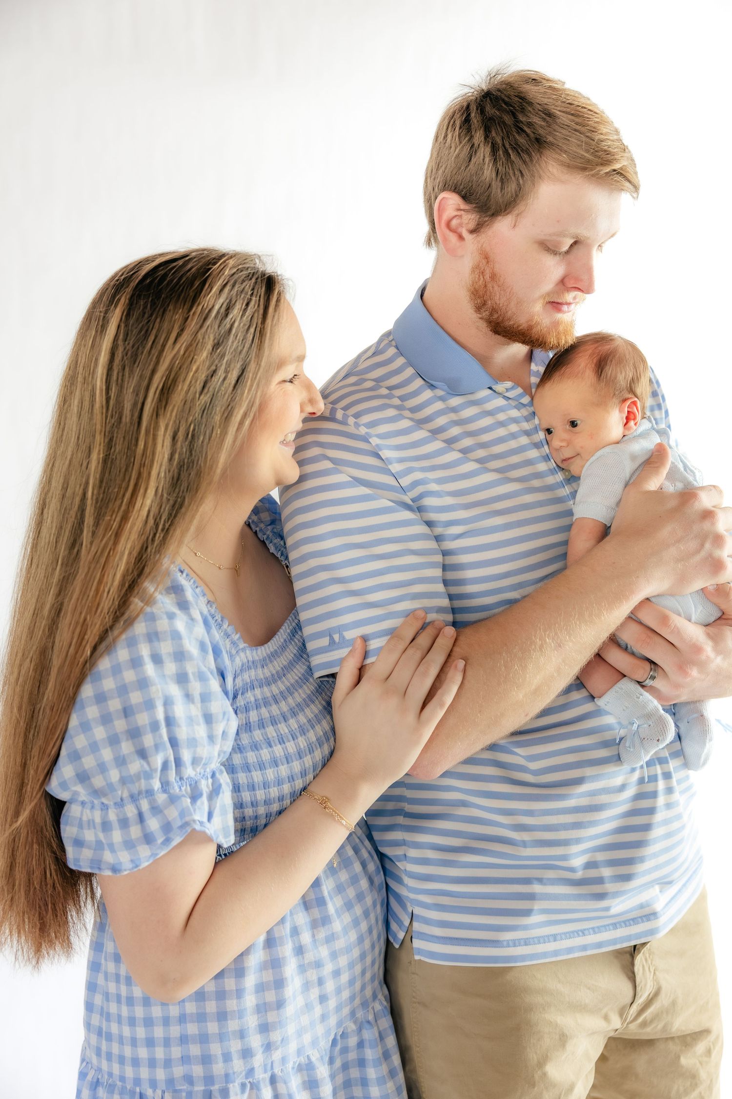 Family holding their baby in a studio in Dothan, Alabama