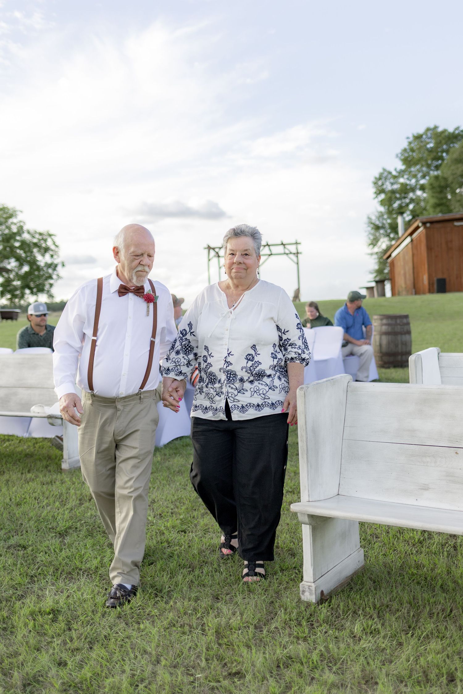 Bridal party walking down the aisle of a wedding at Hilltop Acres Wicksburg, Alabama