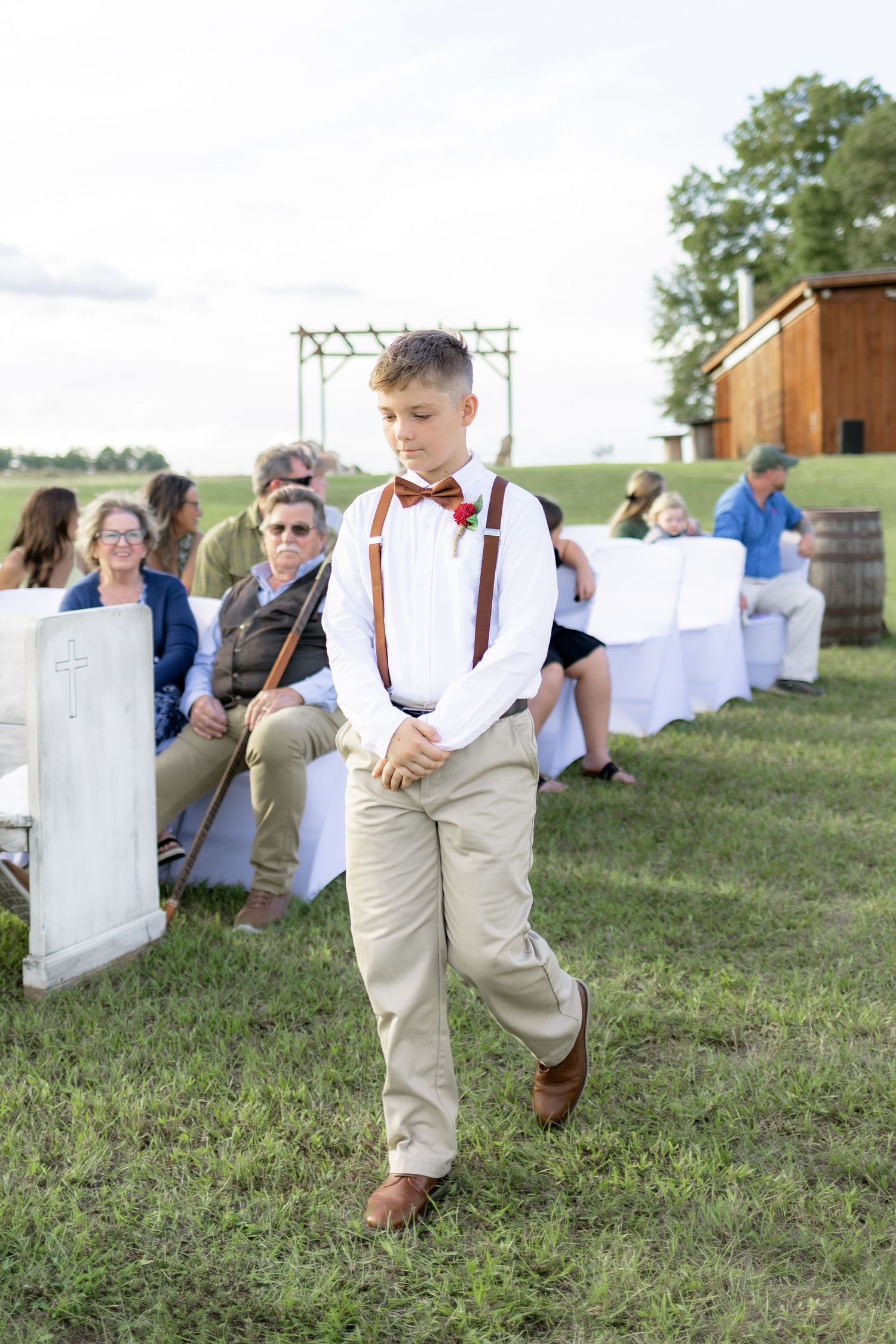 Bridal party walking down the aisle of a wedding at Hilltop Acres Wicksburg, Alabama