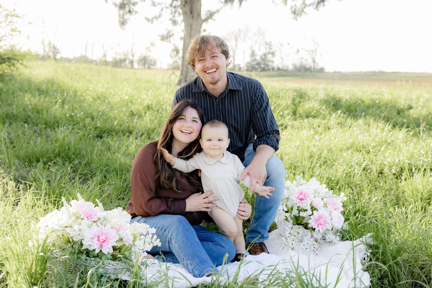 Spring Mini Session with baby chicks in a grass field at sunset near Dothan, Alabama