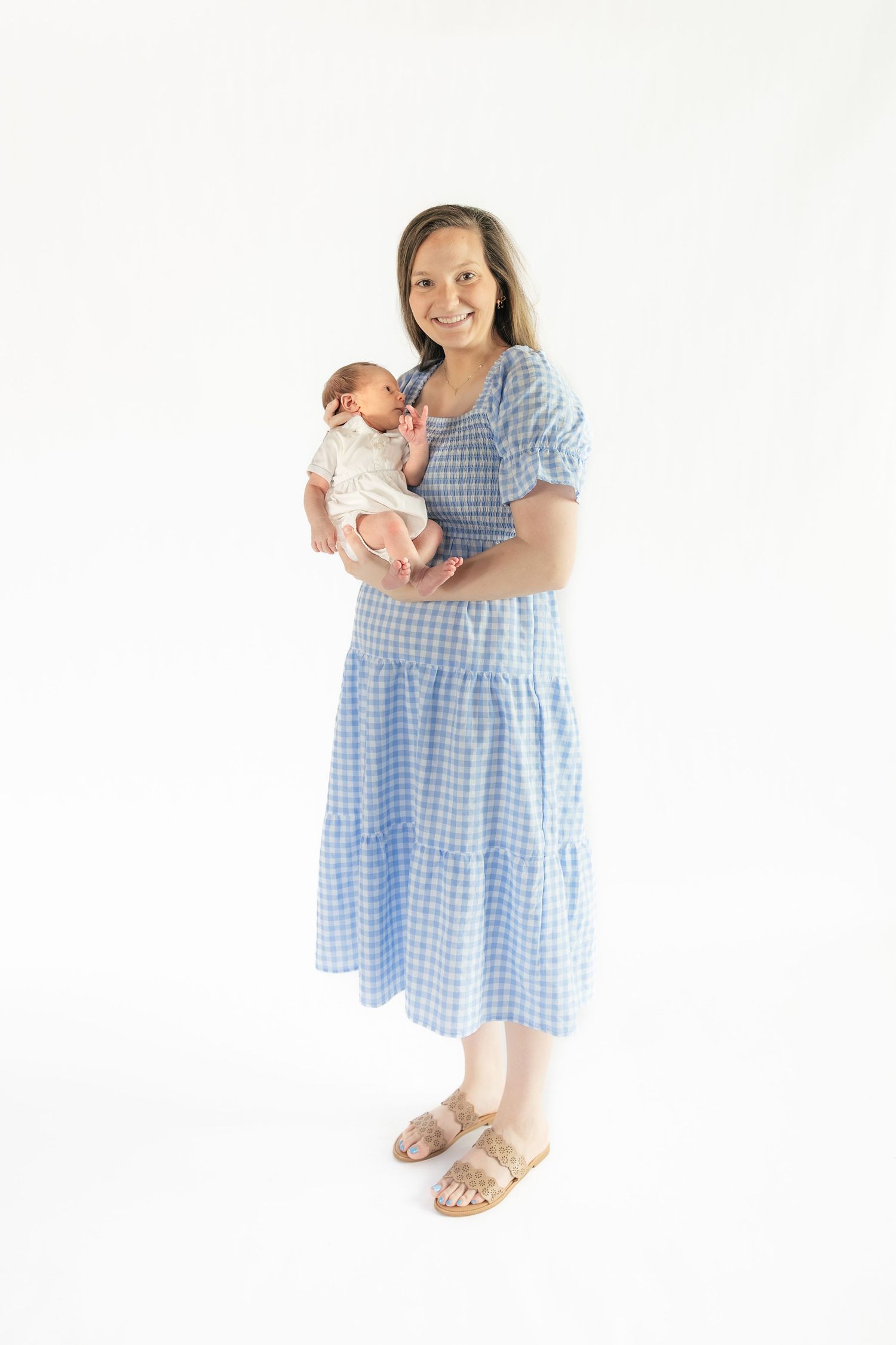 Mother holding her baby in a Studio in Dothan, Alabama