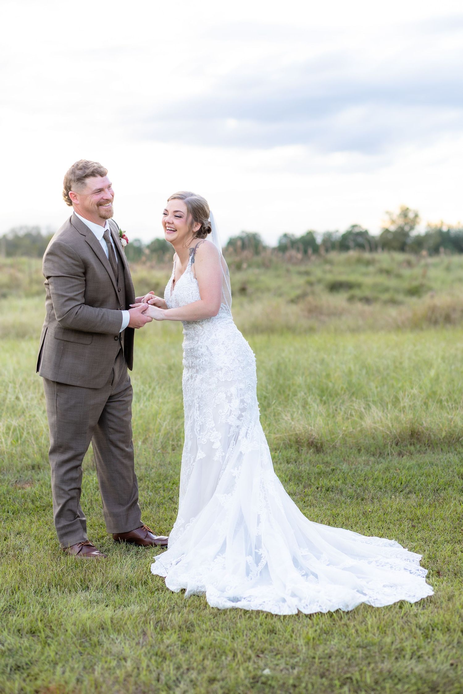 Bride and groom hold each other at sunset at Hilltop Acres Wicksburg, Alabama