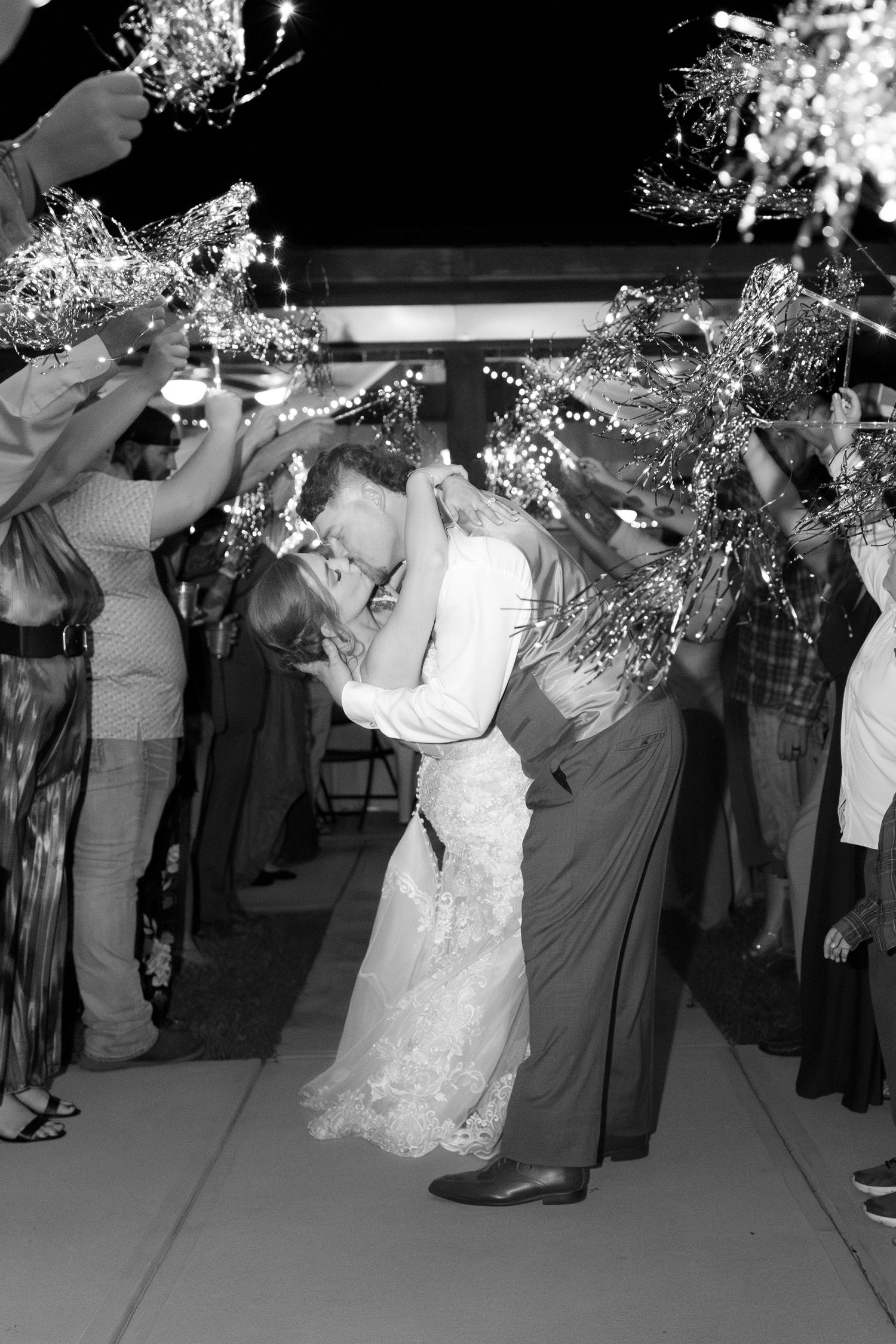 Bride and groom exit through sparklers at their wedding at Hilltop Acres Wicksburg, Alabama