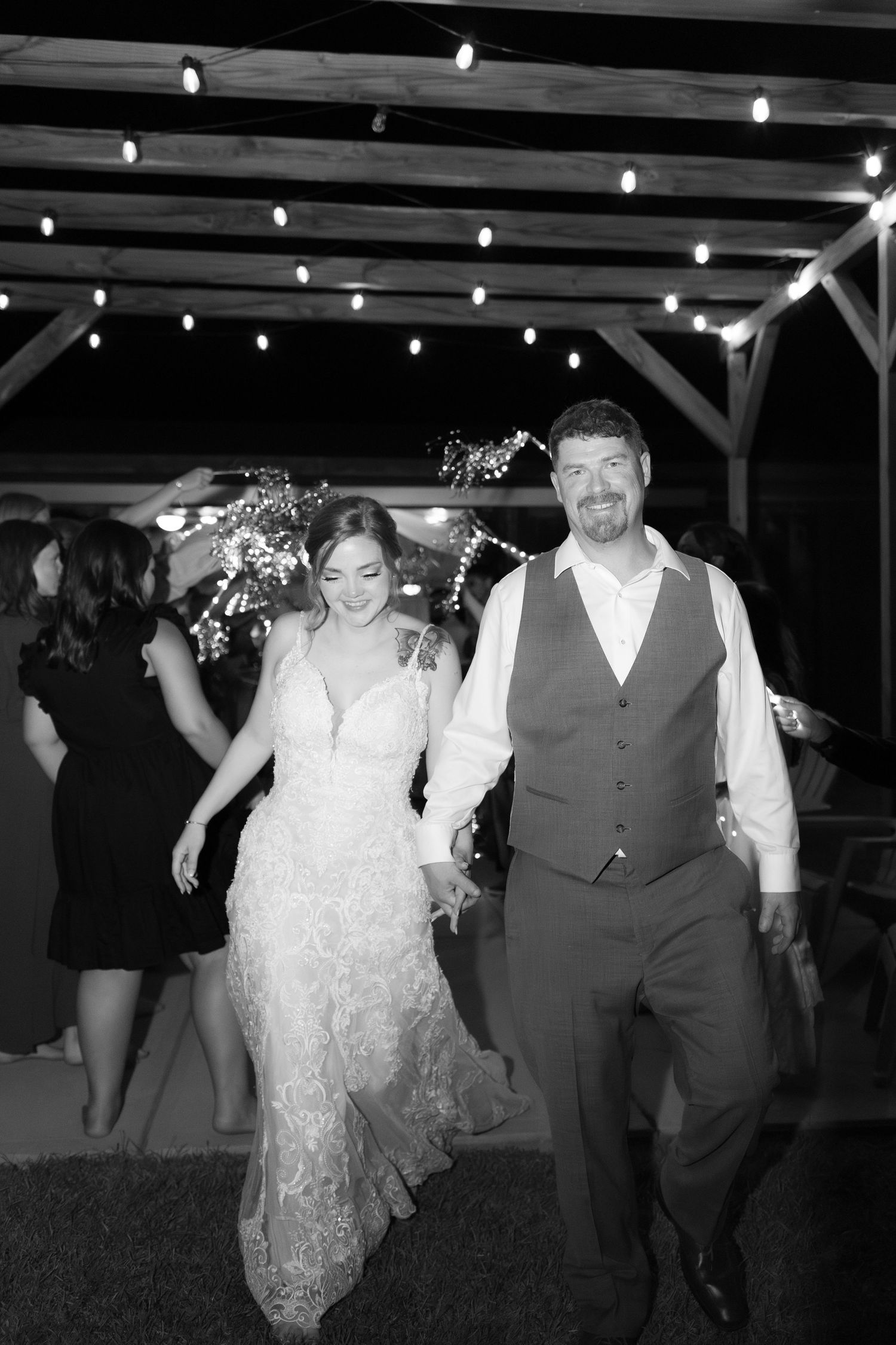 Bride and groom exit through sparklers at their wedding at Hilltop Acres Wicksburg, Alabama