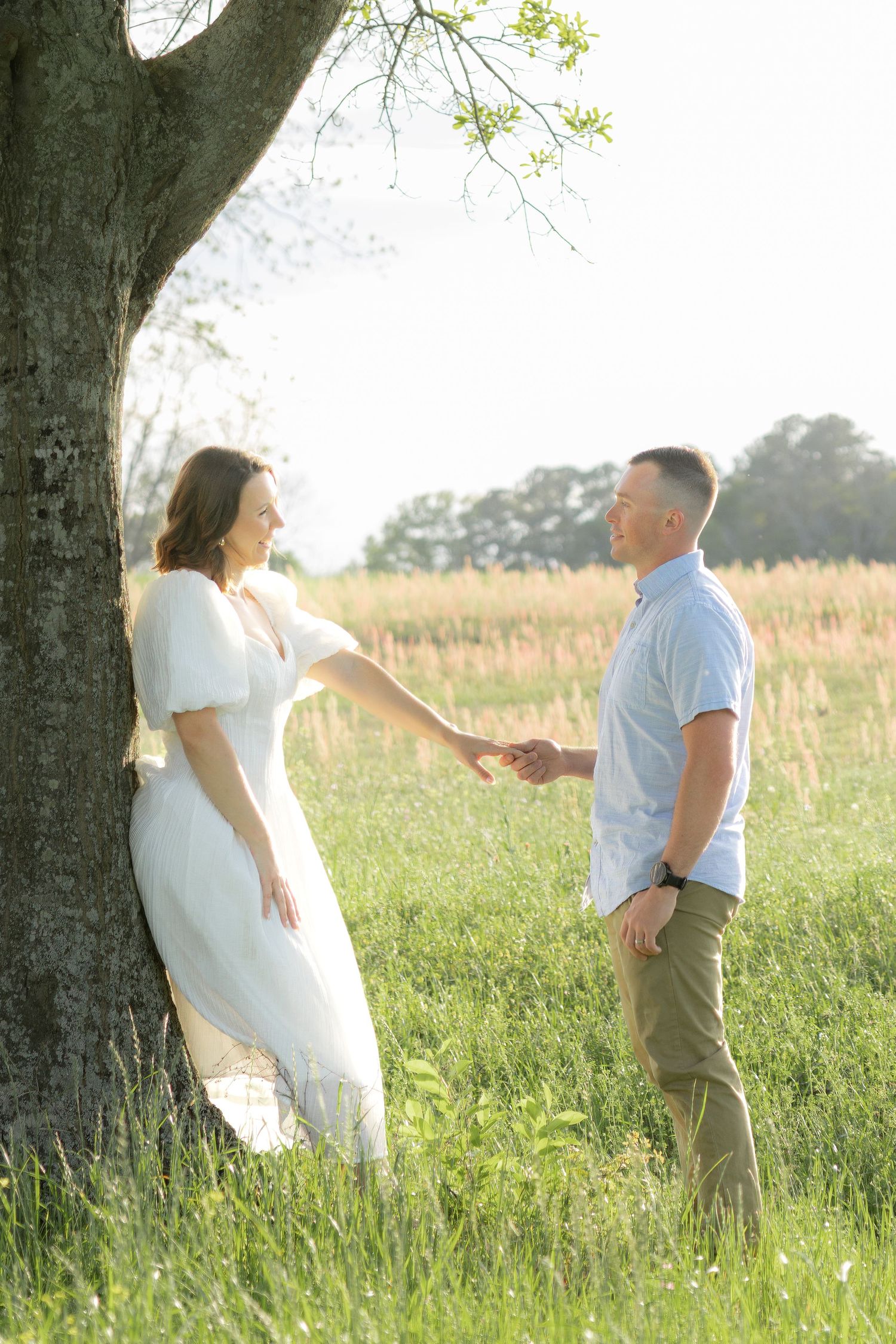 Storytelling romantic couple photos in a tall grass field at sunset in Dothan, Alabama