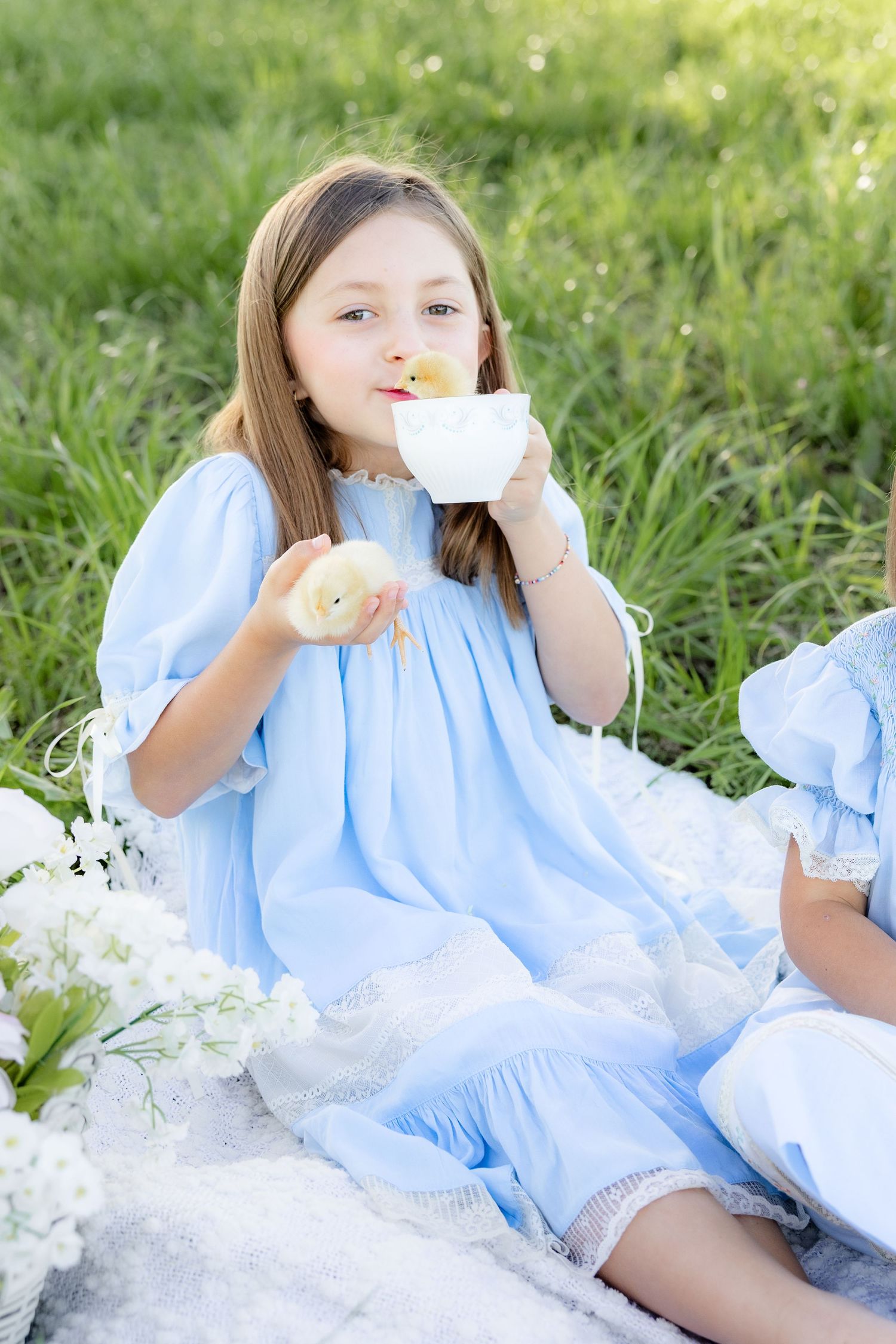 Spring Mini Session with baby chicks in a grass field at sunset near Dothan, Alabama