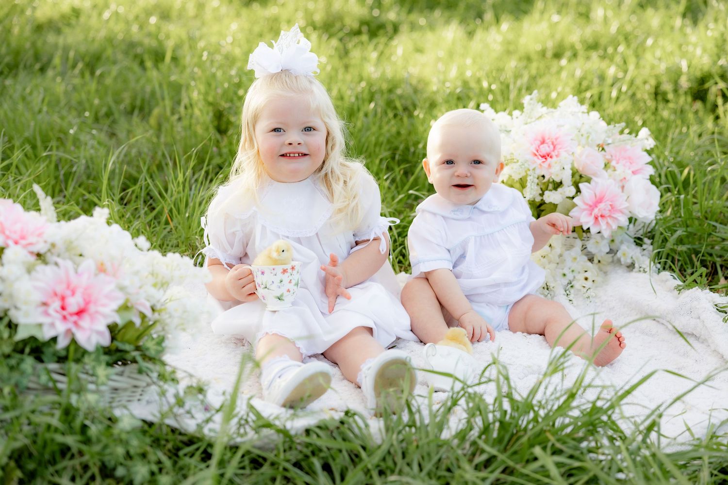 Spring Mini Session with baby chicks in a grass field at sunset near Dothan, Alabama