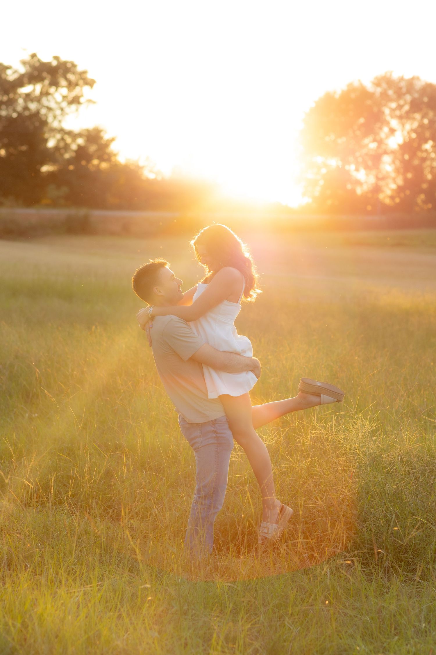 Couple dancing in a field during sunset near Dothan, Alabama