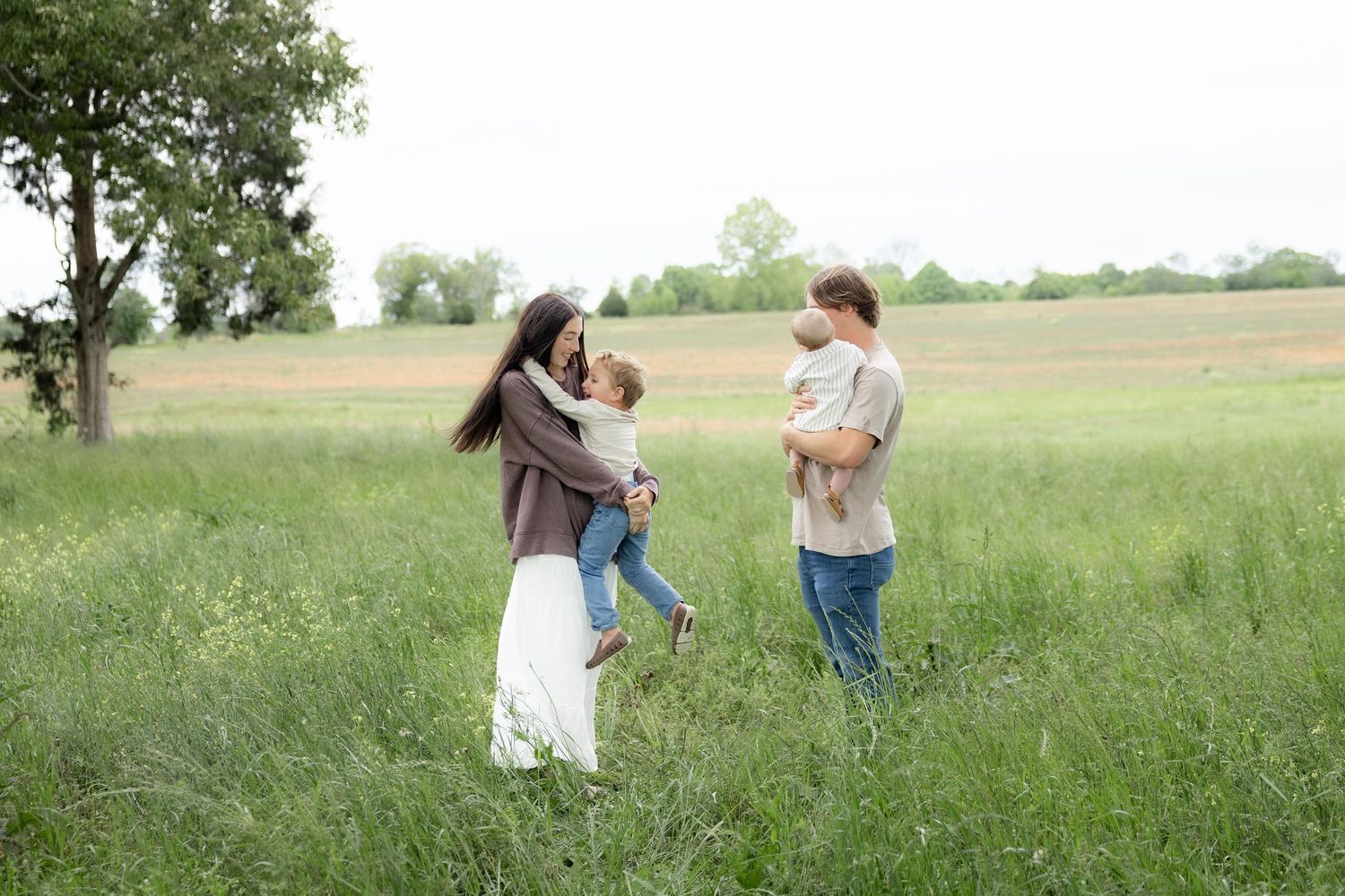 Candid family photos in a grass field | Dothan, Alabama Lifestyle Portrait Photographer