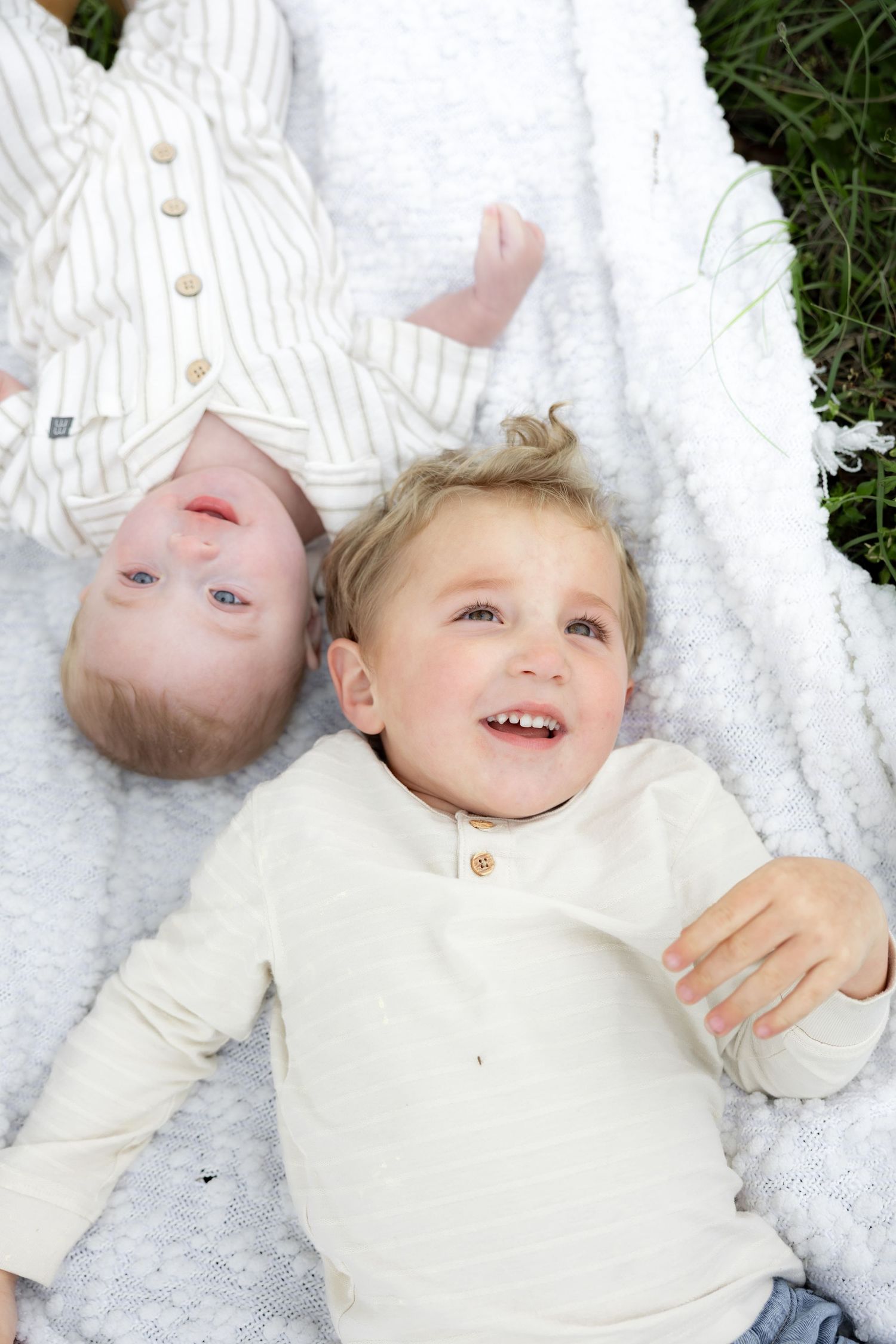 Candid family photos in a grass field | Dothan, Alabama Lifestyle Portrait Photographer