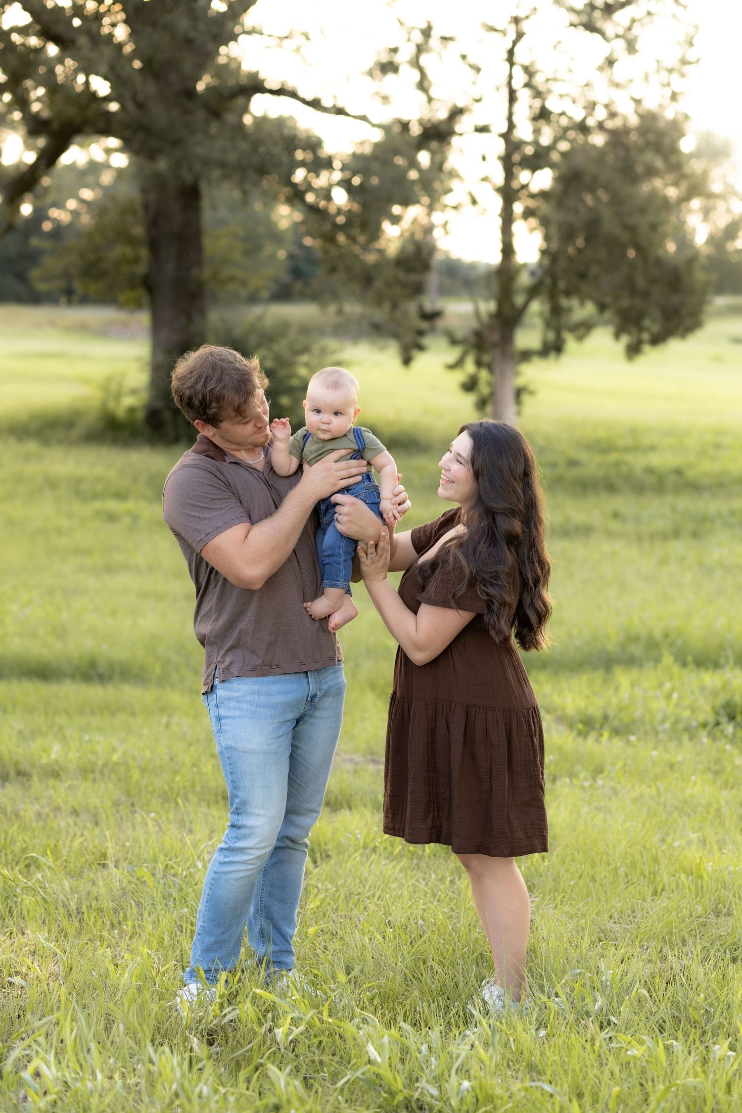 Family Pictures in a grass field at sunset near Dothan, Alabama
