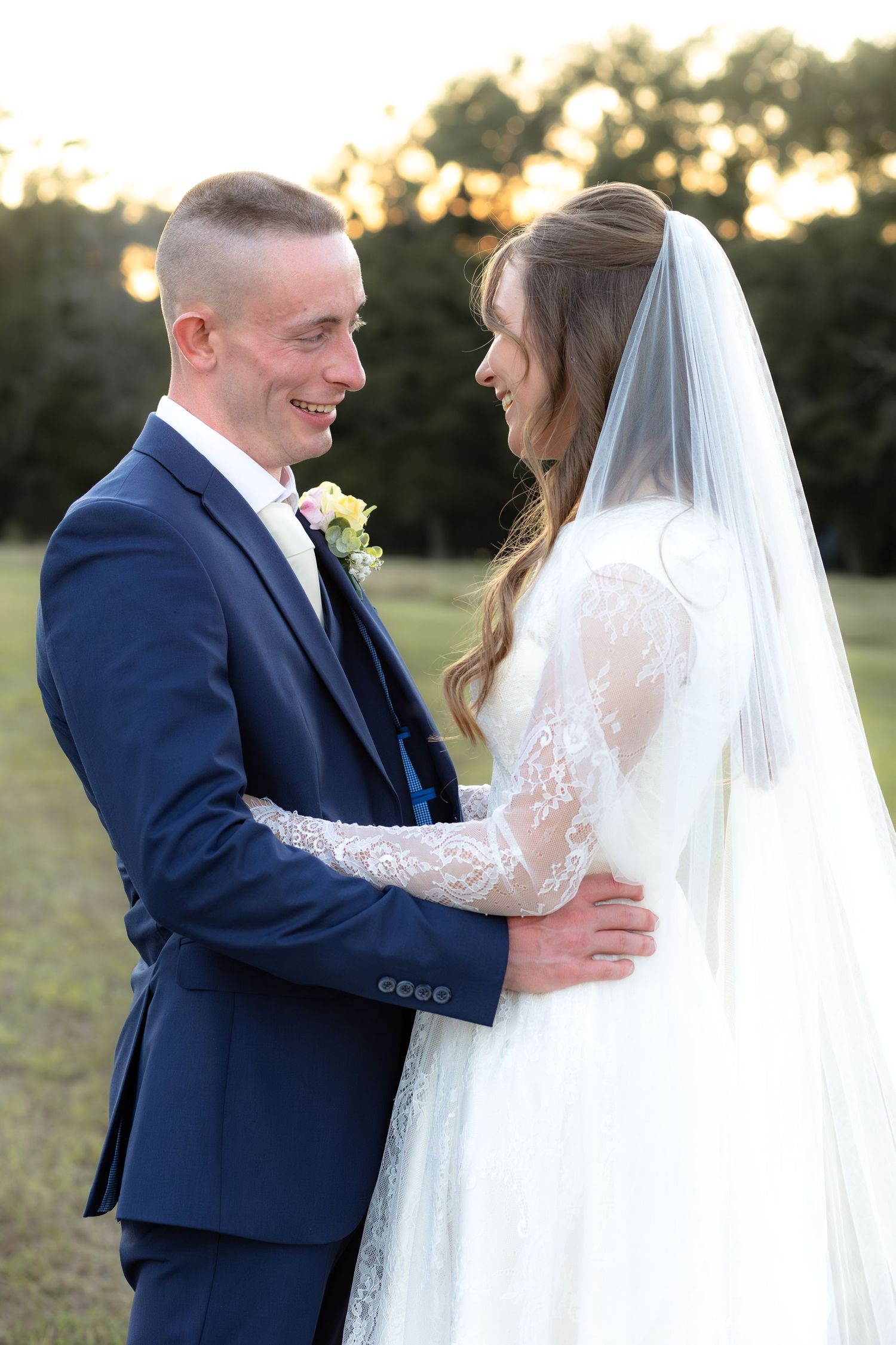 Bride and groom holding each other for portraits at Dalrymple Farms Enterprise, Alabama