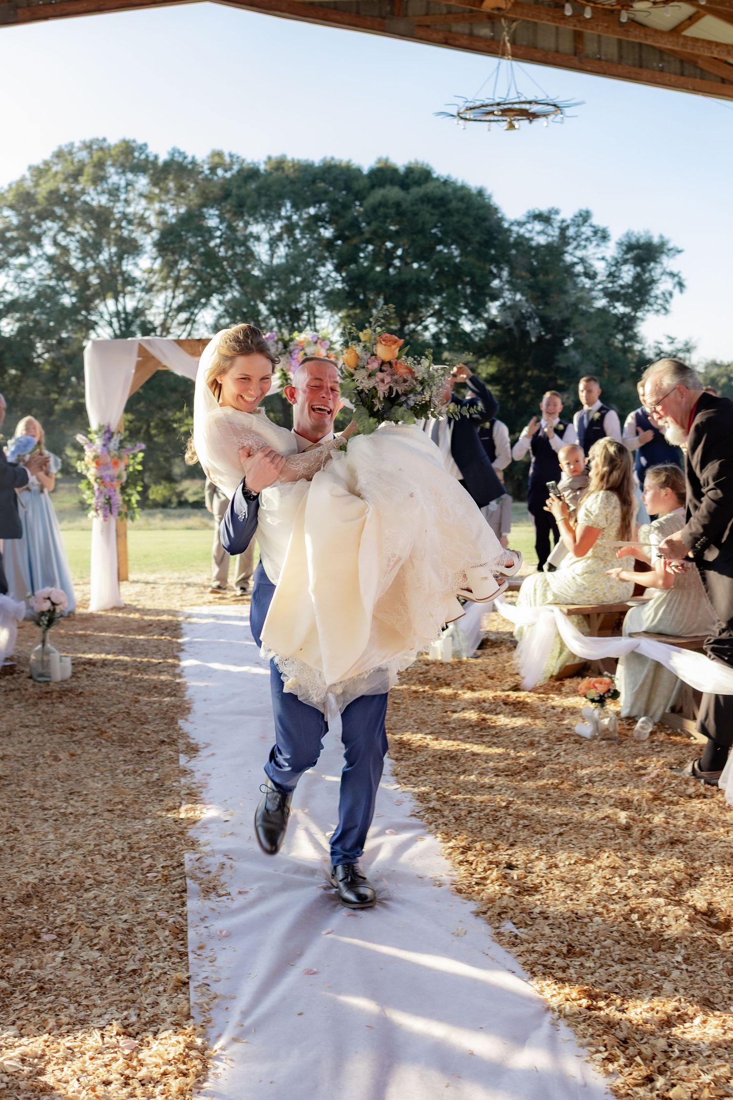 Bride and groom running back up the aisle after getting married at Dalrymple Farms Enterprise, Alabama