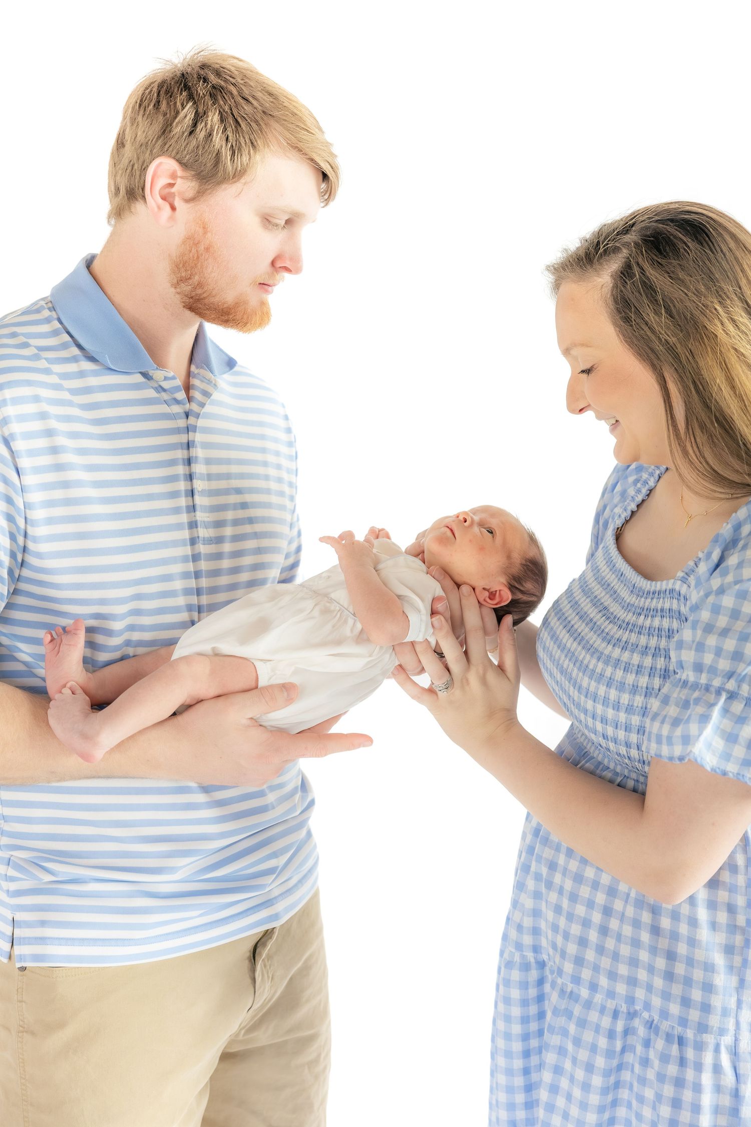 Family holding their baby in a studio in Dothan, Alabama