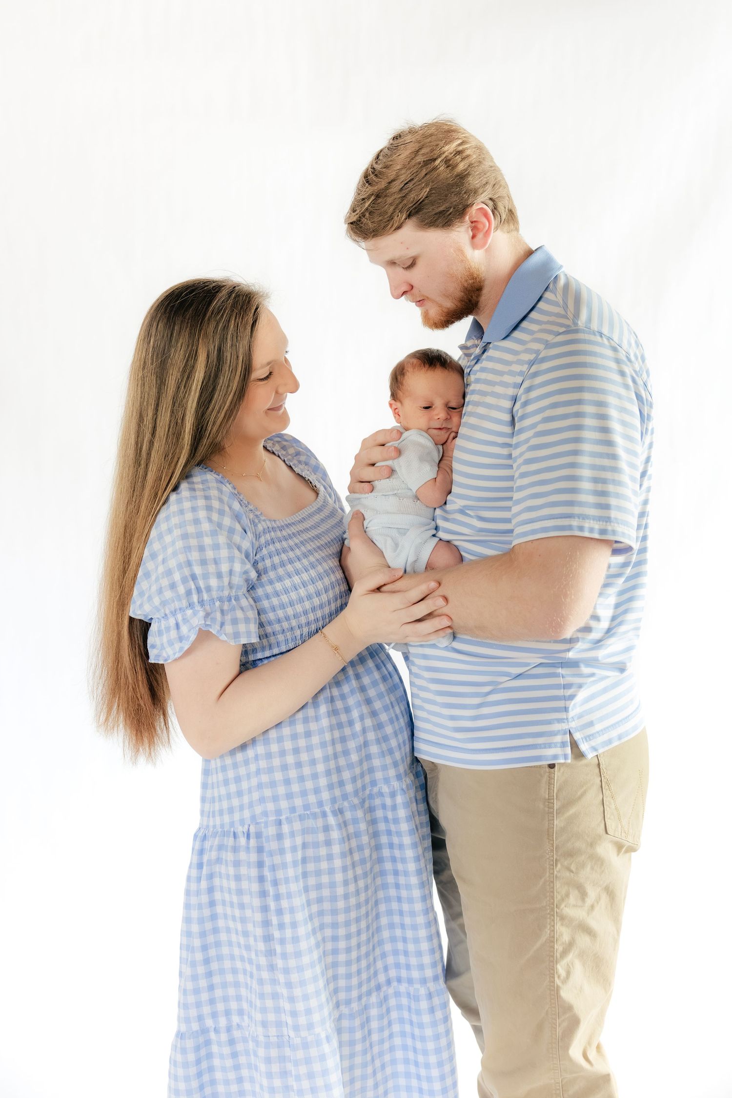 Family holding their baby in a studio in Dothan, Alabama