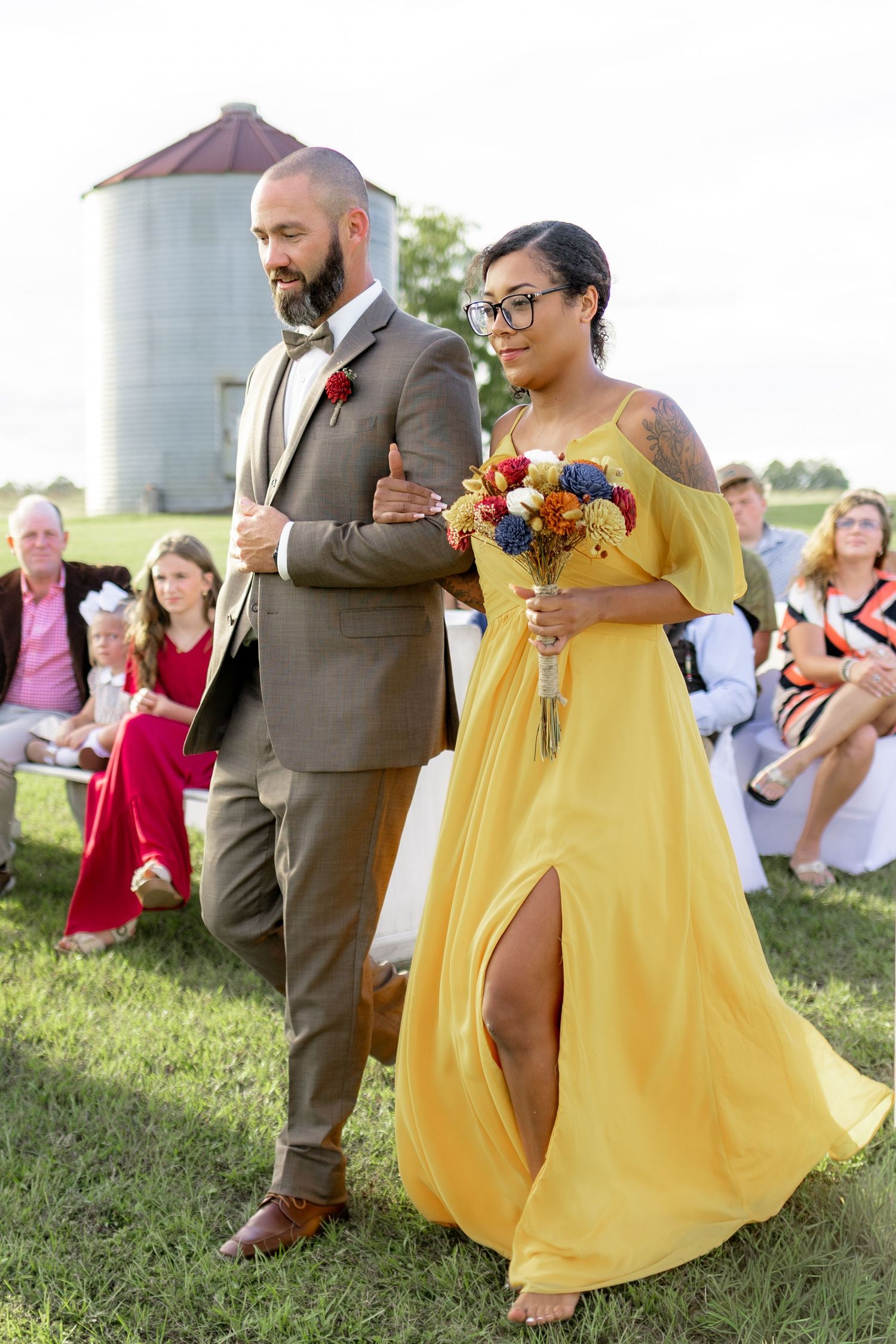 Bridal party walking down the aisle of a wedding at Hilltop Acres Wicksburg, Alabama