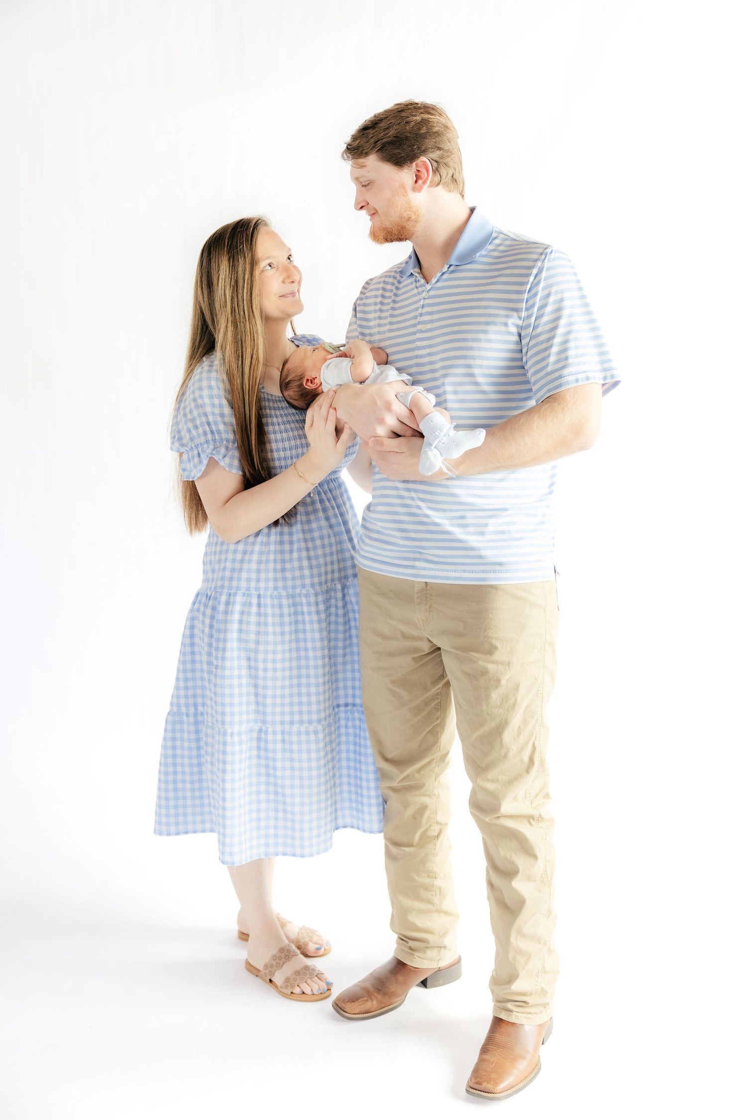 Family holding their baby in a studio in Dothan, Alabama
