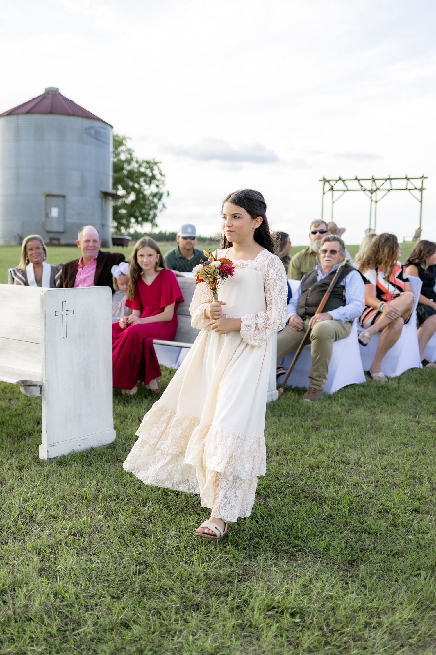 Bridal party walking down the aisle of a wedding at Hilltop Acres Wicksburg, Alabama