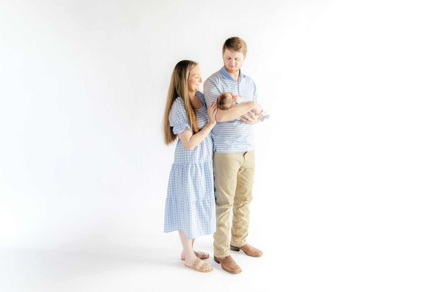 Family holding their baby in a studio in Dothan, Alabama