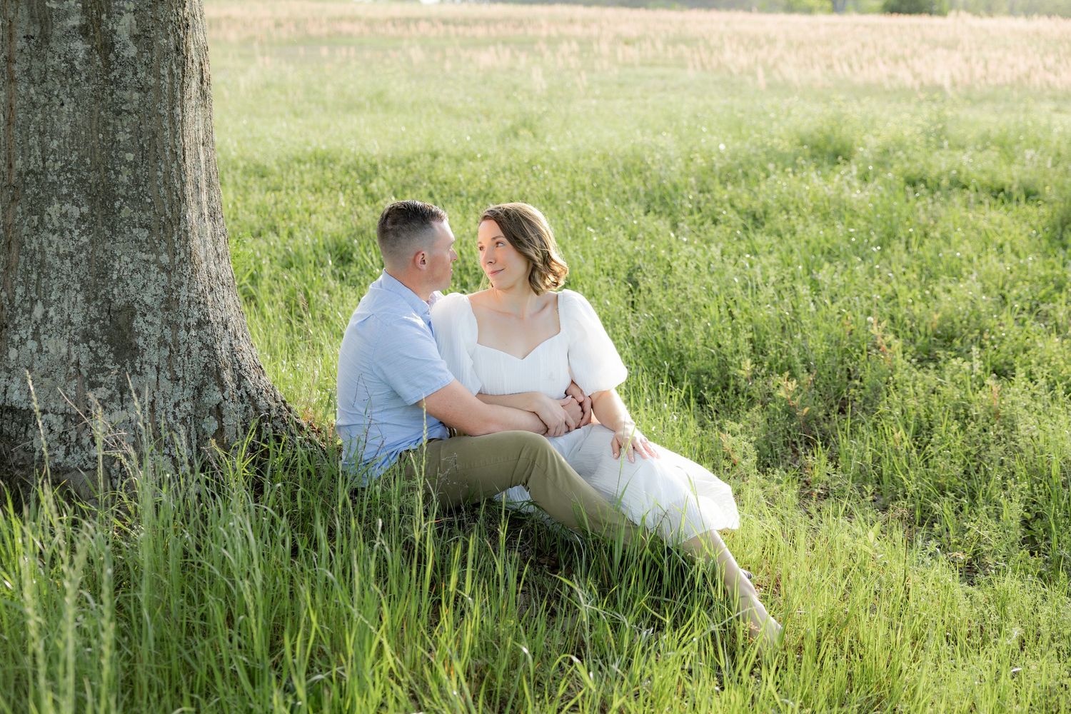 Storytelling romantic couple photos in a tall grass field at sunset in Dothan, Alabama