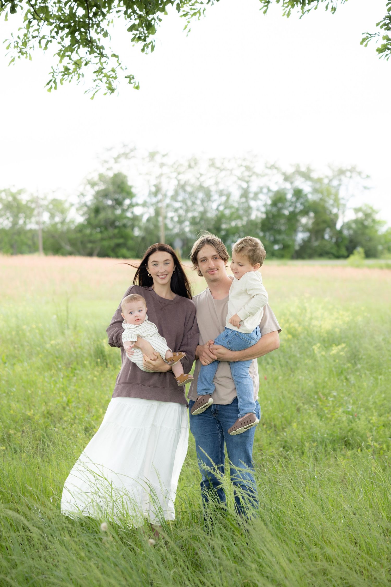 Candid family photos in a grass field | Dothan, Alabama Lifestyle Portrait Photographer