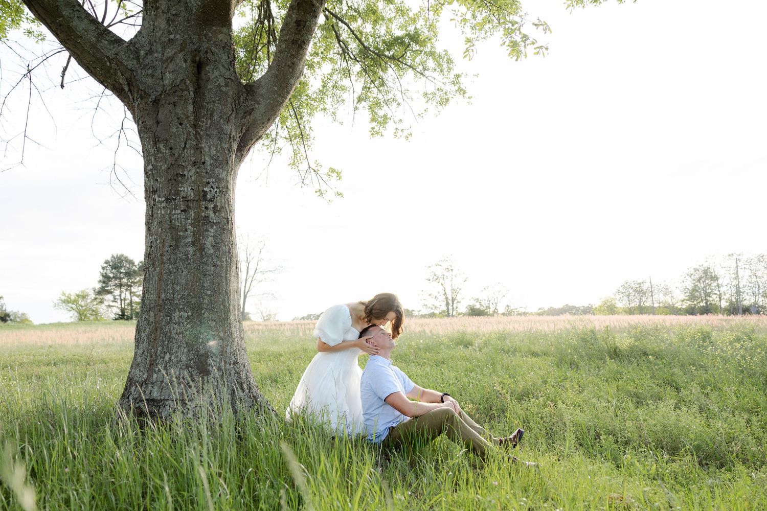 Storytelling romantic couple photos in a tall grass field at sunset in Dothan, Alabama