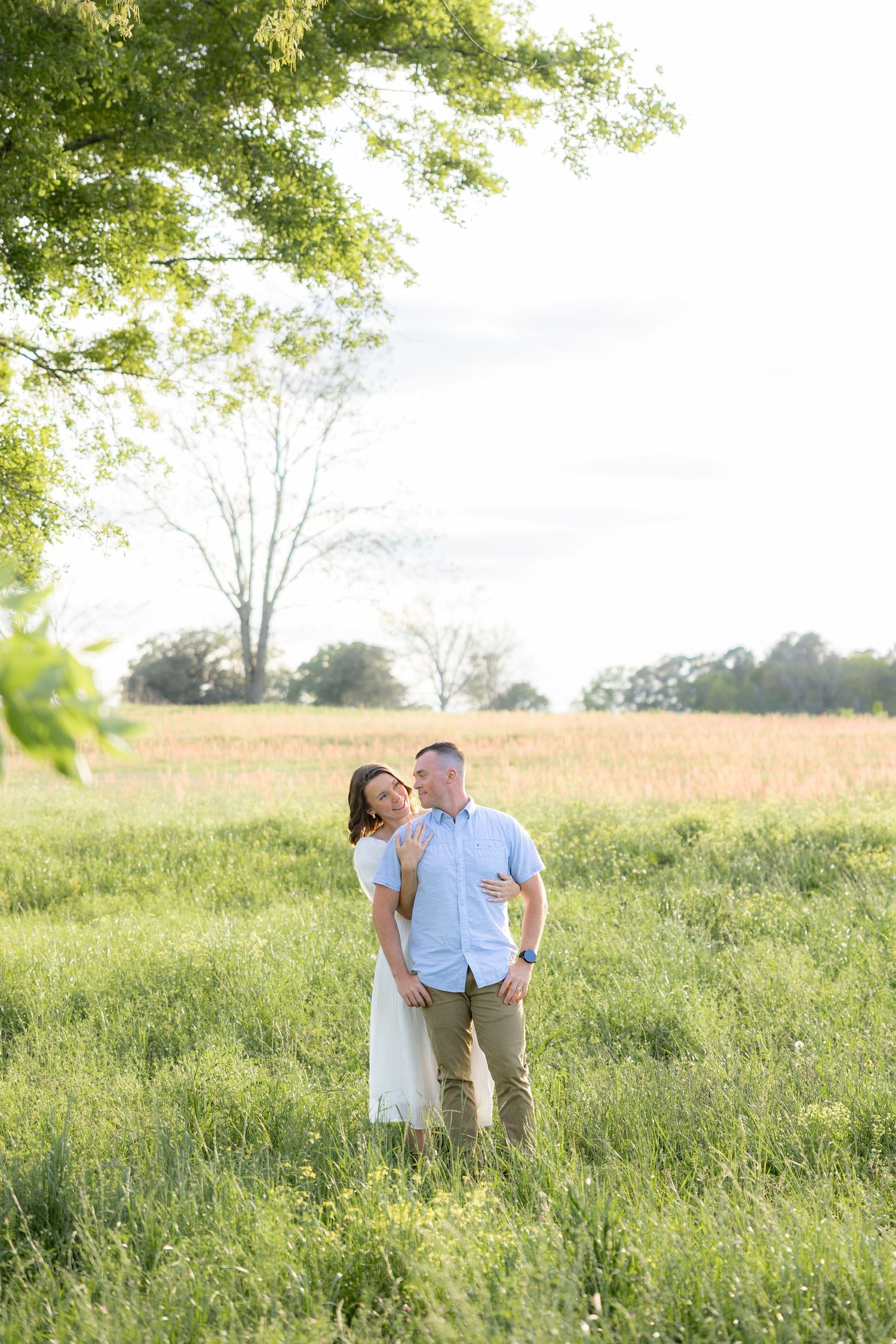 Storytelling romantic couple photos in a tall grass field at sunset in Dothan, Alabama