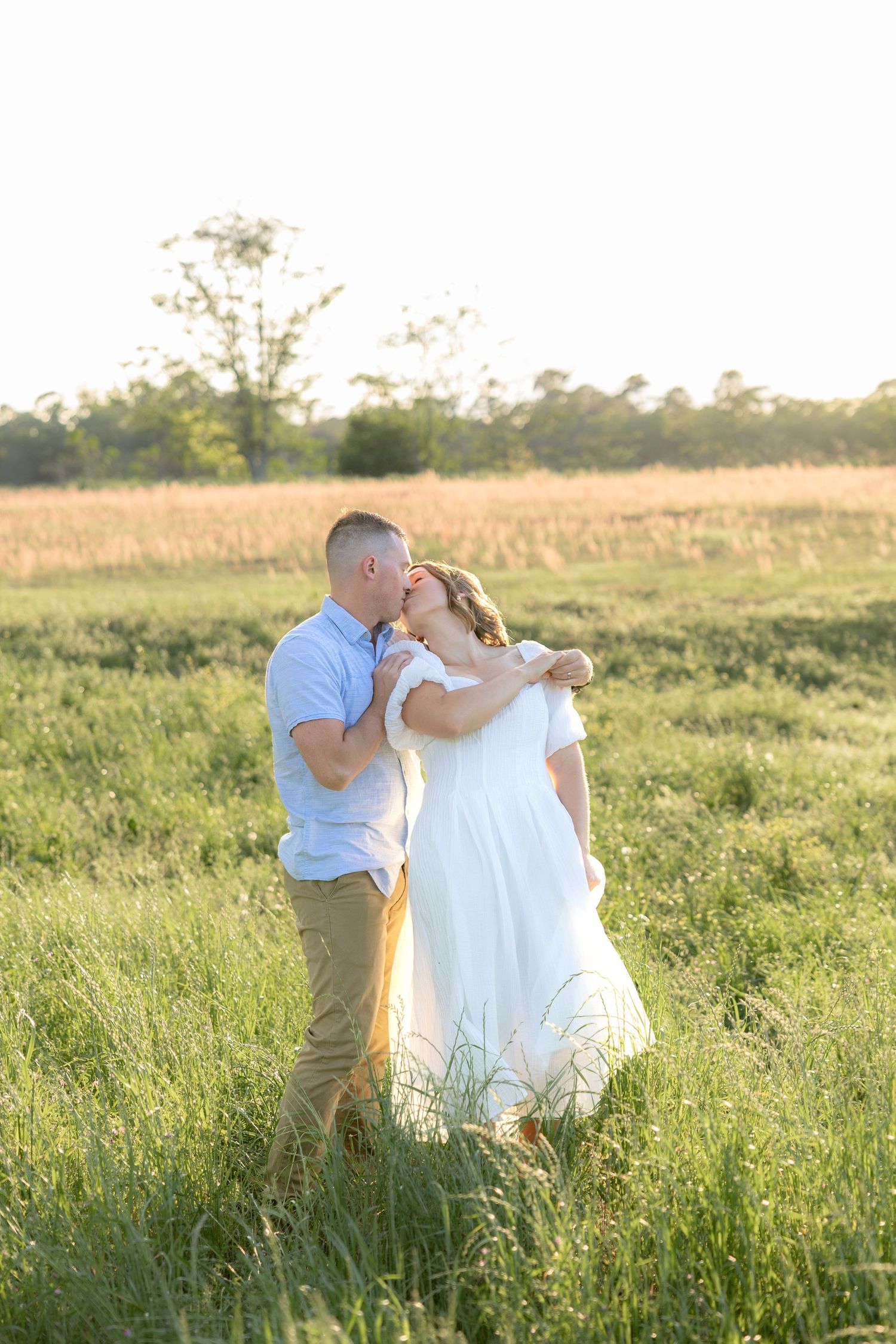 Storytelling couple photos in a tall grass field at sunset in Dothan, Alabama