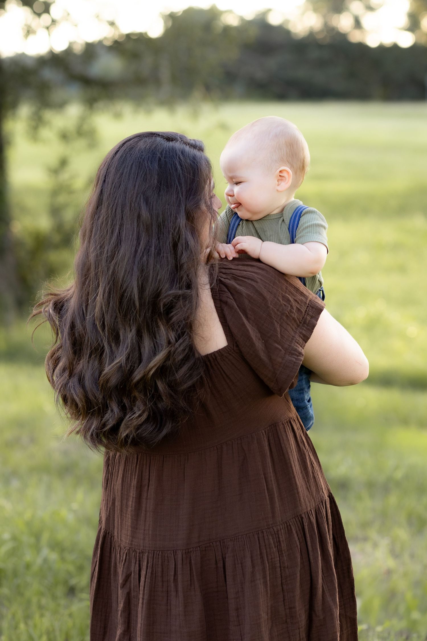 Family Pictures in a grass field at sunset near Dothan, Alabama