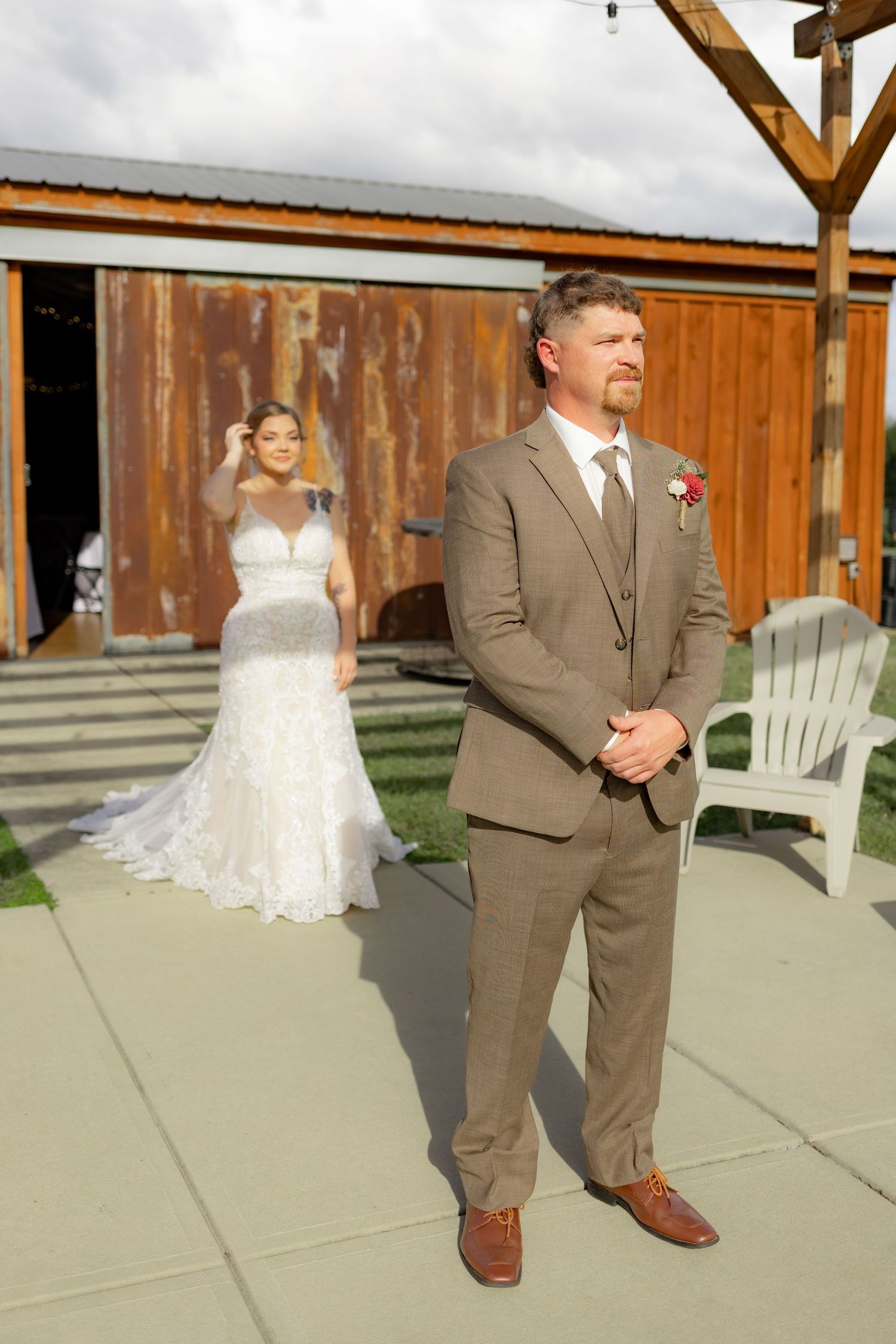Groom first look with bride underneath the gazebo at Hilltop Acres Wicksburg, Alabama