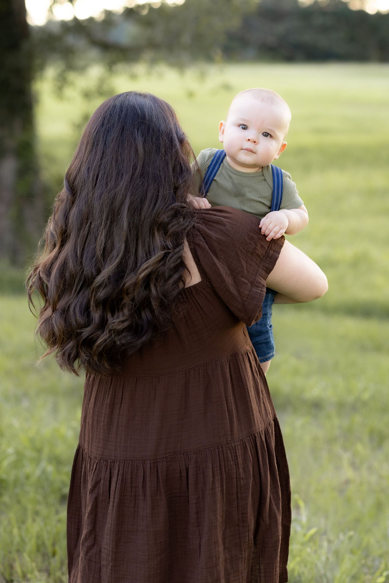 Family Pictures in a grass field at sunset near Dothan, Alabama