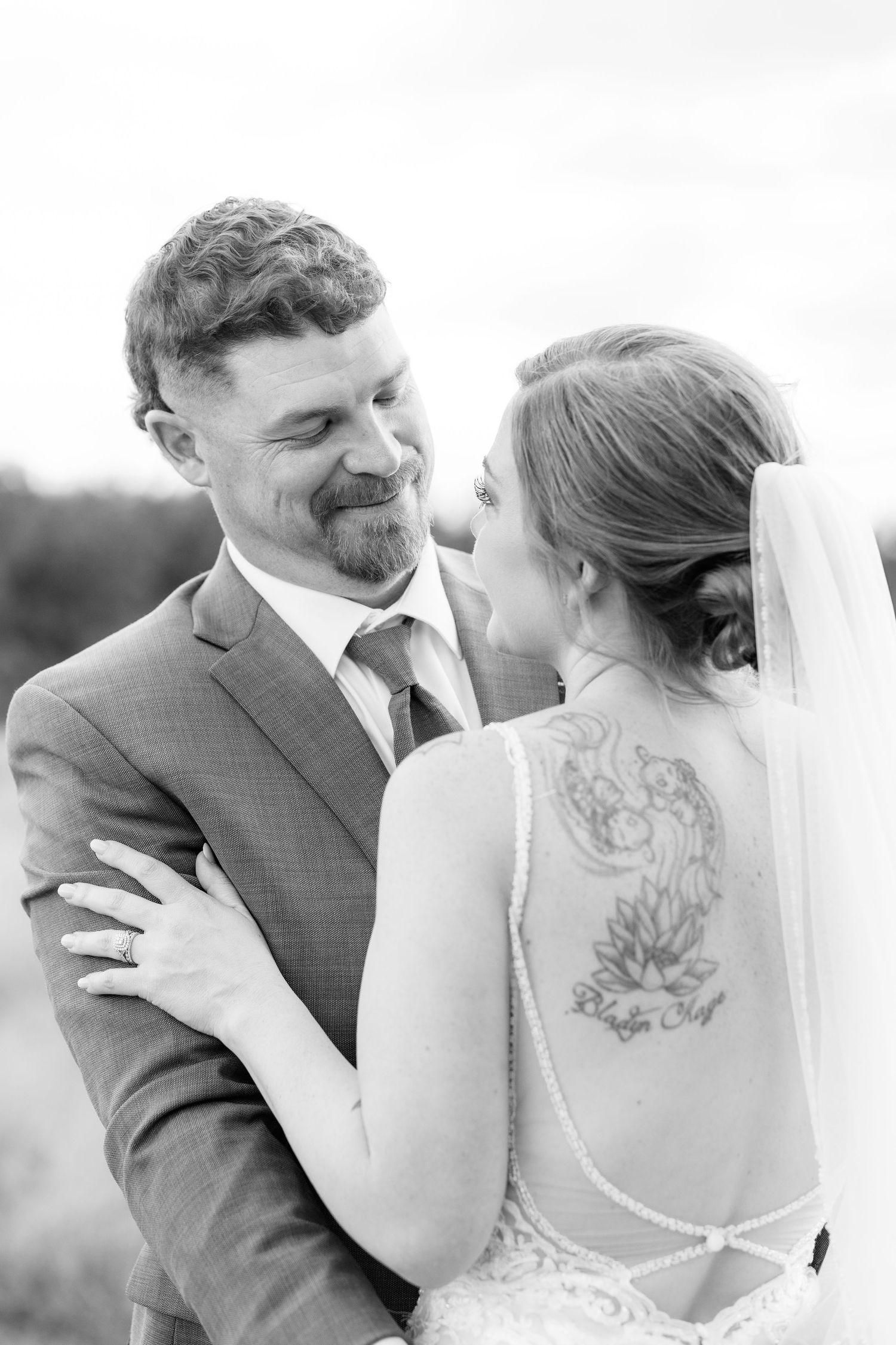 Bride and groom hold each other at sunset at Hilltop Acres Wicksburg, Alabama