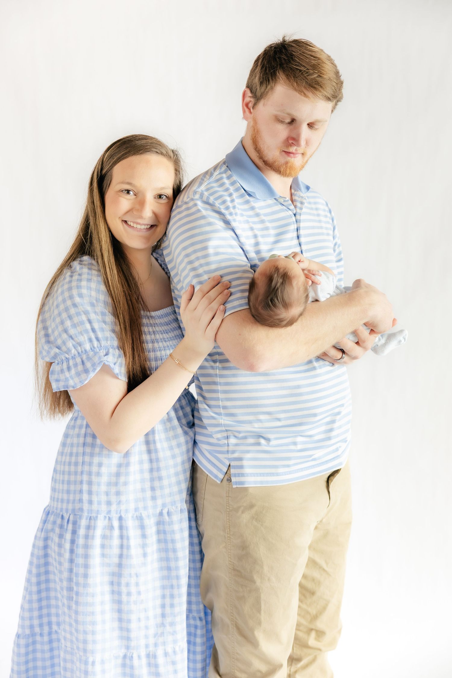 Family holding their baby in a studio in Dothan, Alabama