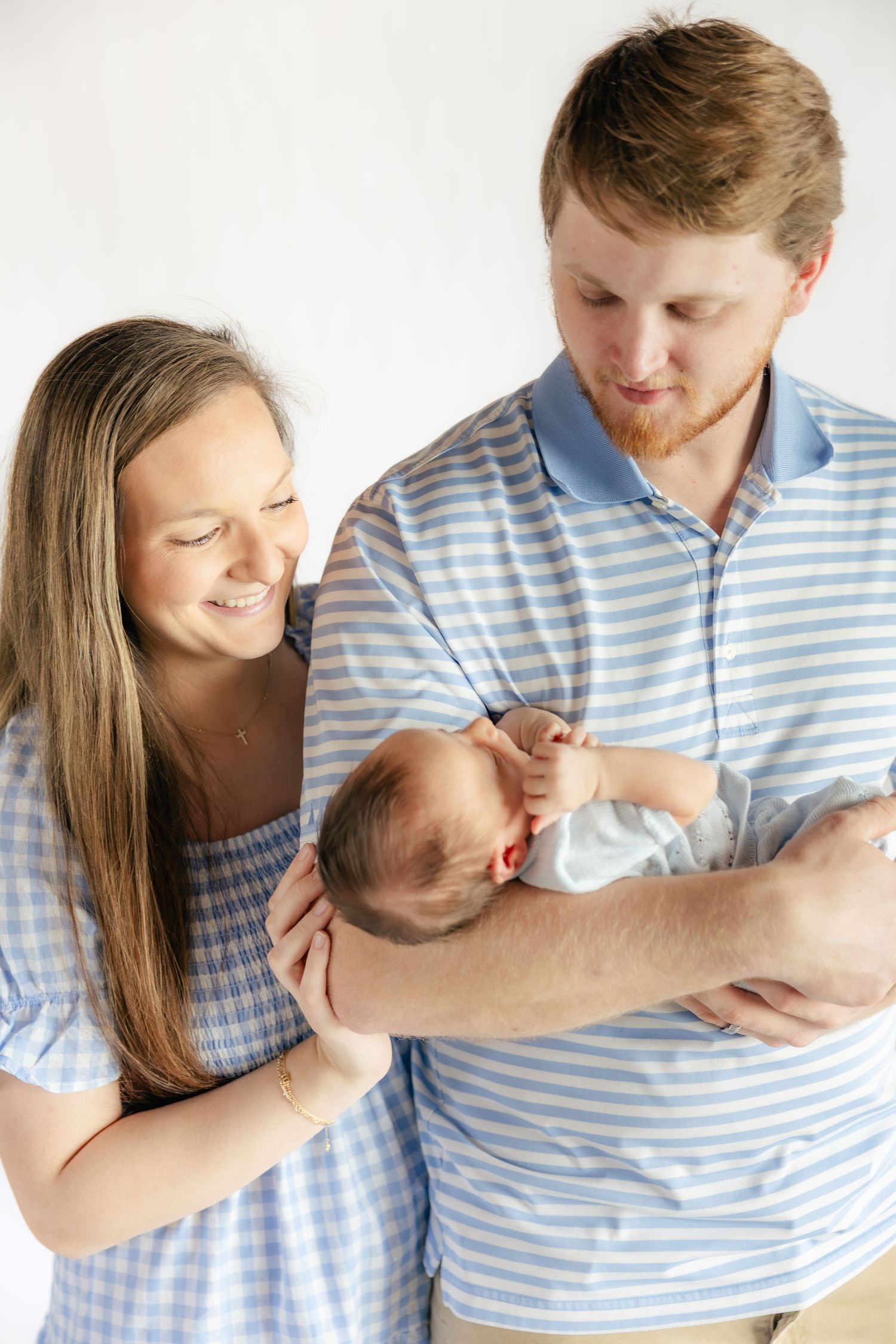 Family holding their baby in a studio in Dothan, Alabama