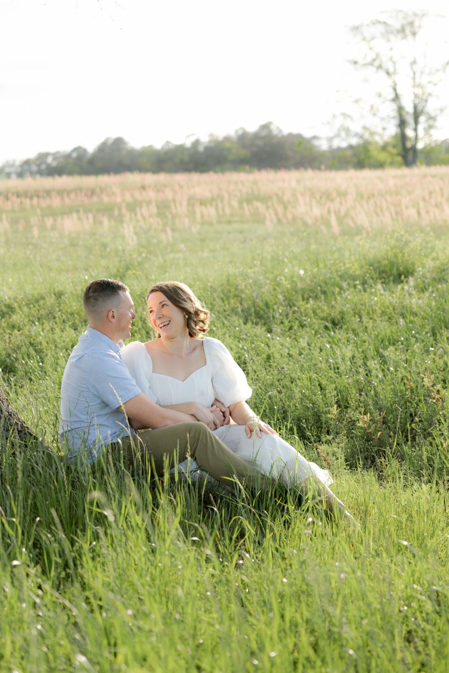 Storytelling romantic couple photos in a tall grass field at sunset in Dothan, Alabama