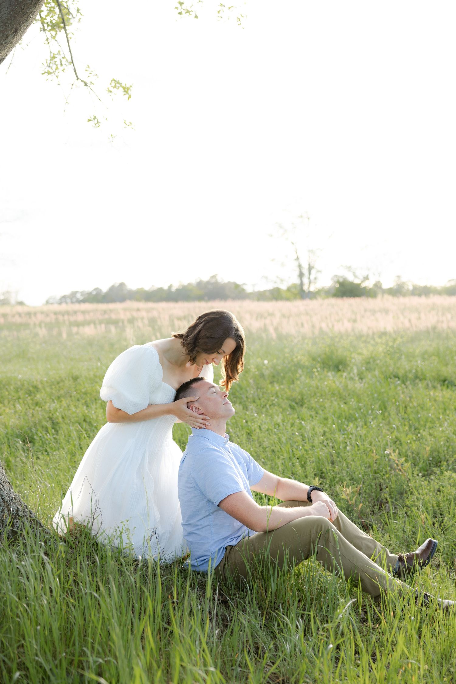 Storytelling romantic couple photos in a tall grass field at sunset in Dothan, Alabama