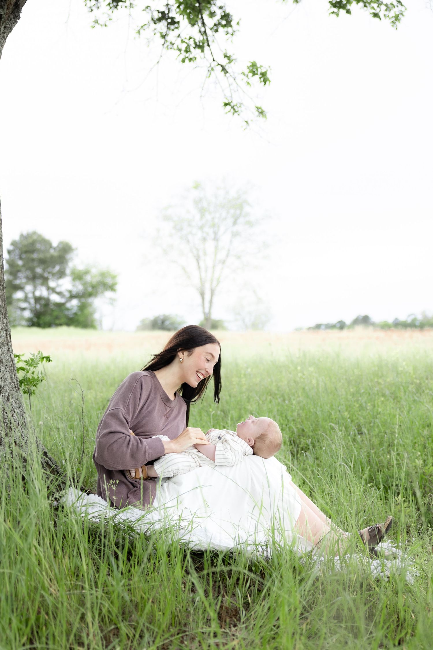 Candid family photos in a grass field | Dothan, Alabama Lifestyle Portrait Photographer