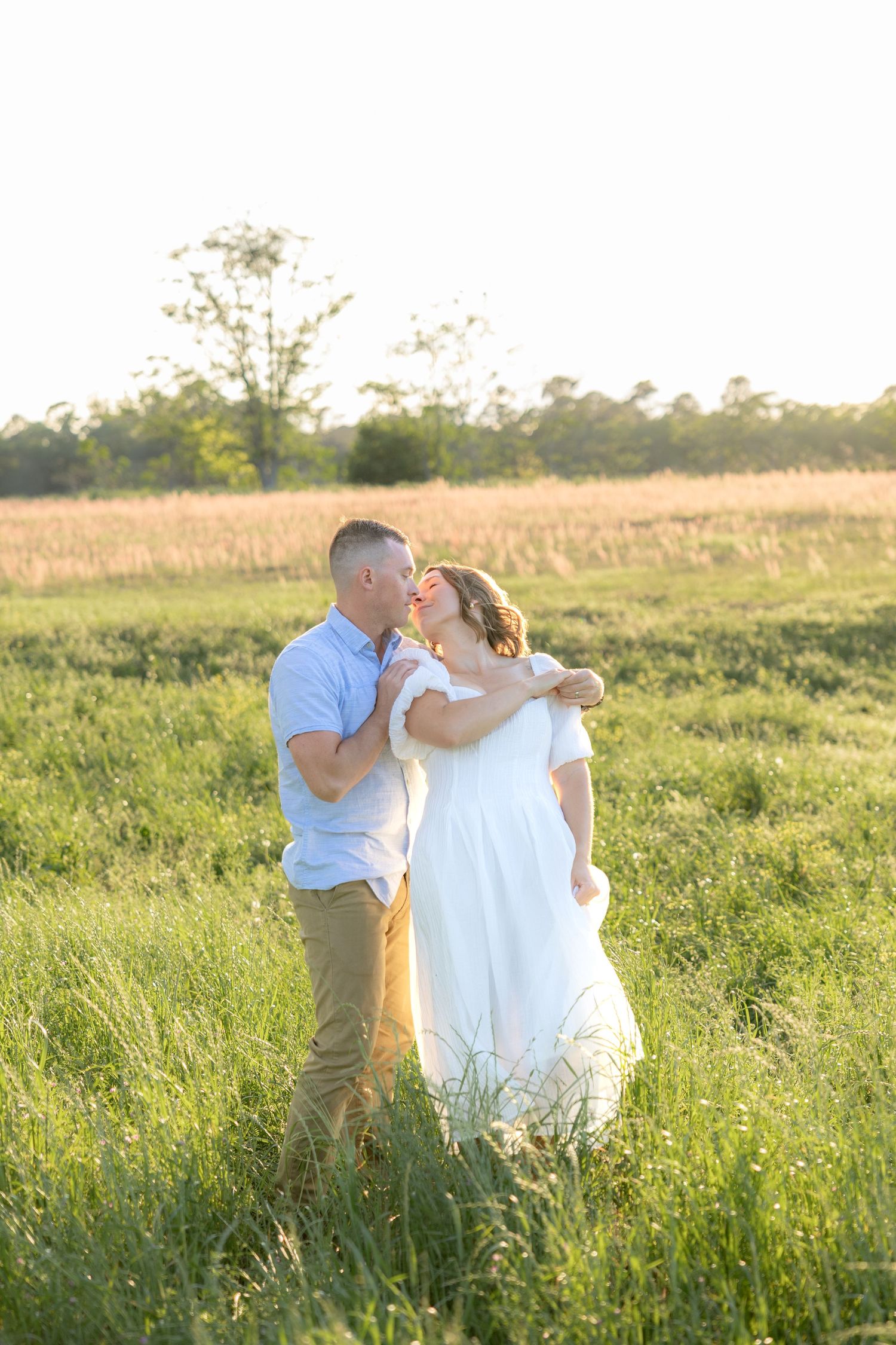 Storytelling couple photos in a tall grass field at sunset in Dothan, Alabama
